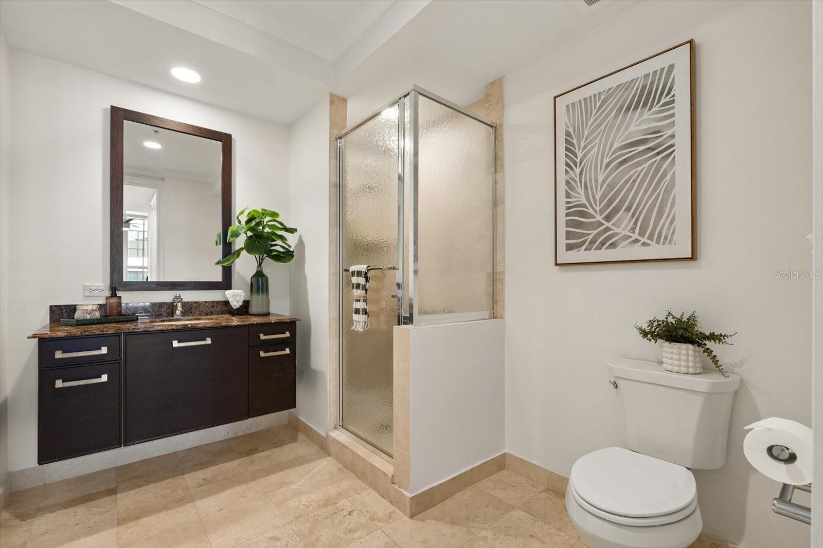 Guest ensuite bathroom with shower stall
