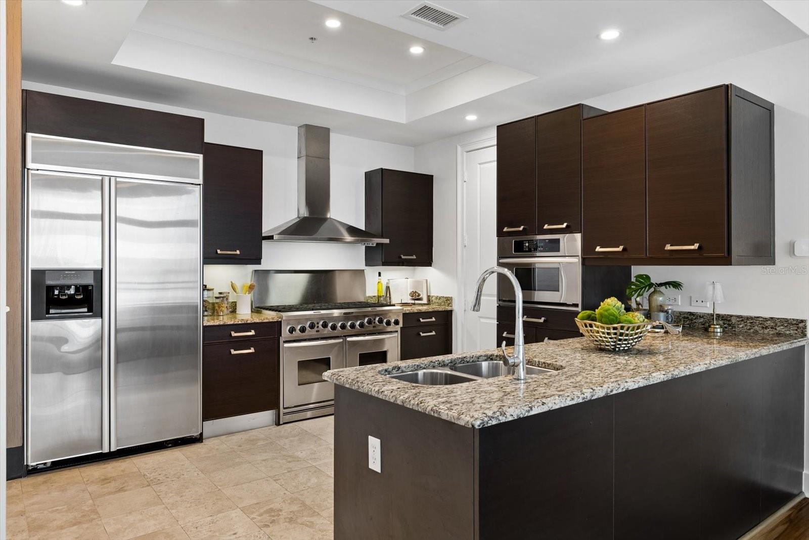 Kitchen with Kitchen aid appliances and gas range, pullout drawers for storage Kitchen with Kitchen aid appliances and gas range, pullout drawers for storage
