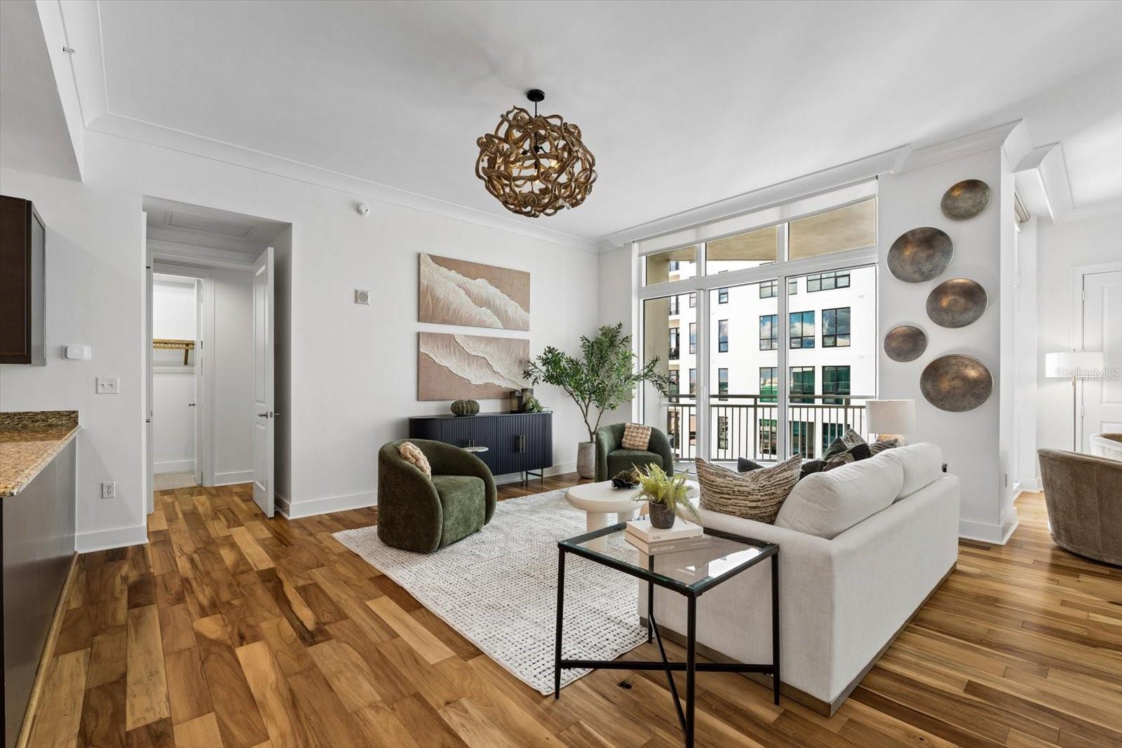 Living room with tall sliders out to a covered balcony Living room with tall sliders out to a covered balcony