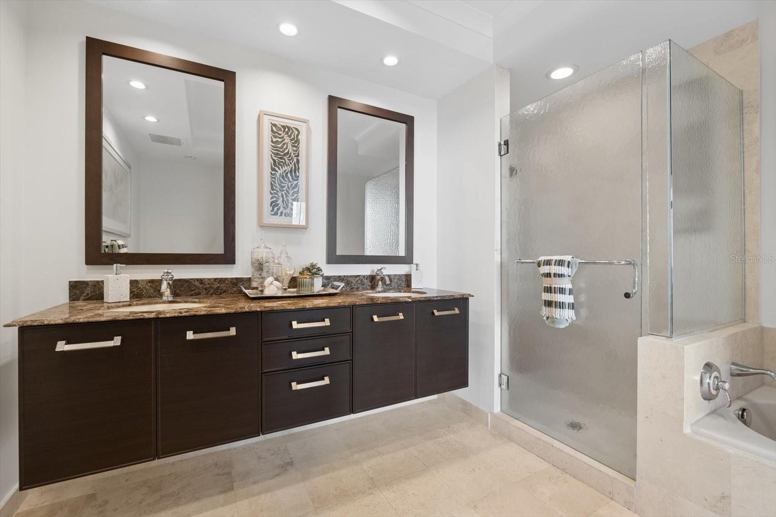 Primary bathroom with stone counters & dal sinks