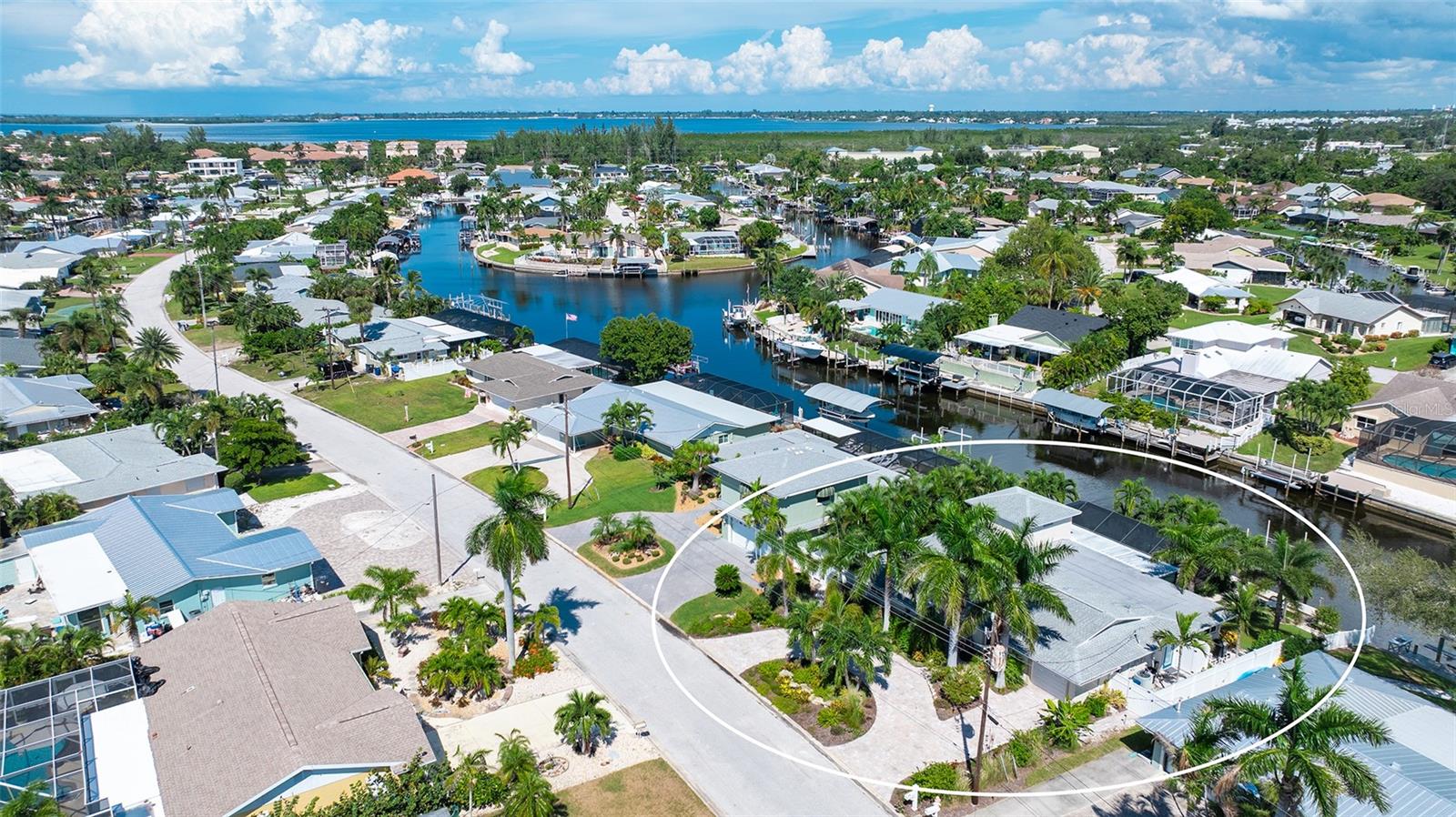 Coral Shores canal living, with waterways stretching toward the coast.