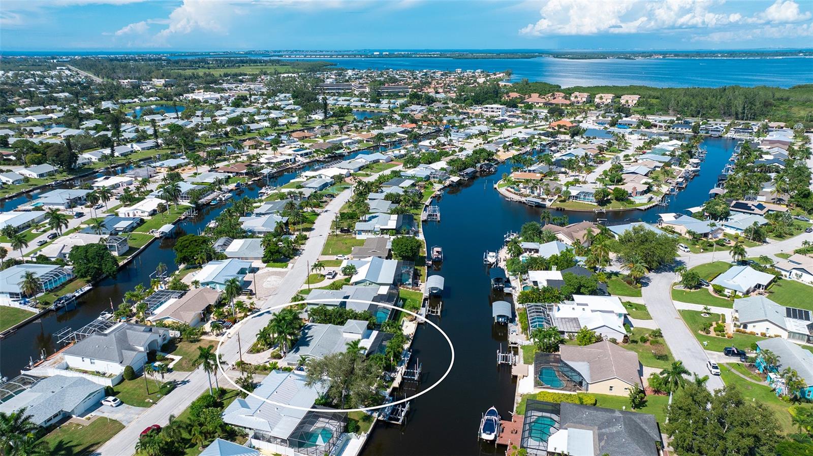An aerial view of the home within the Coral Shores waterways.