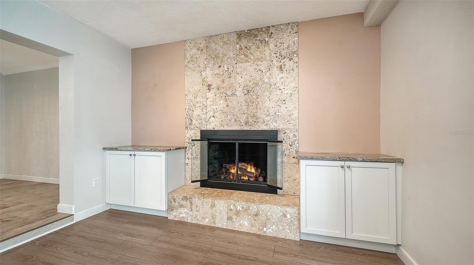 A fireplace feature wall creates a natural gathering spot.
