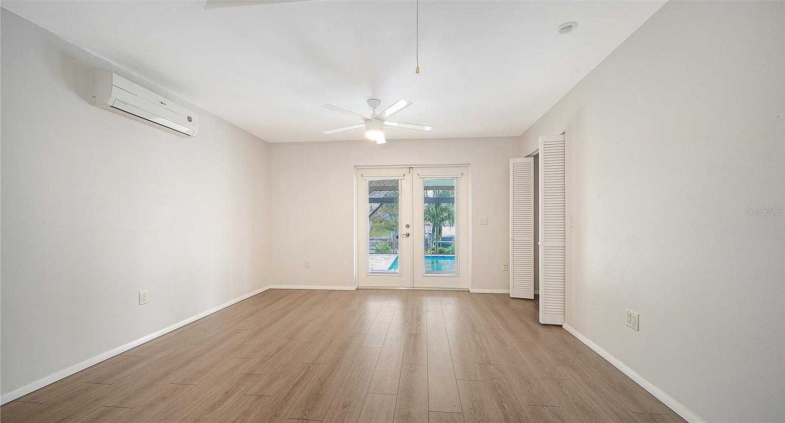 French doors bring the poolside lifestyle close to your bedroom.