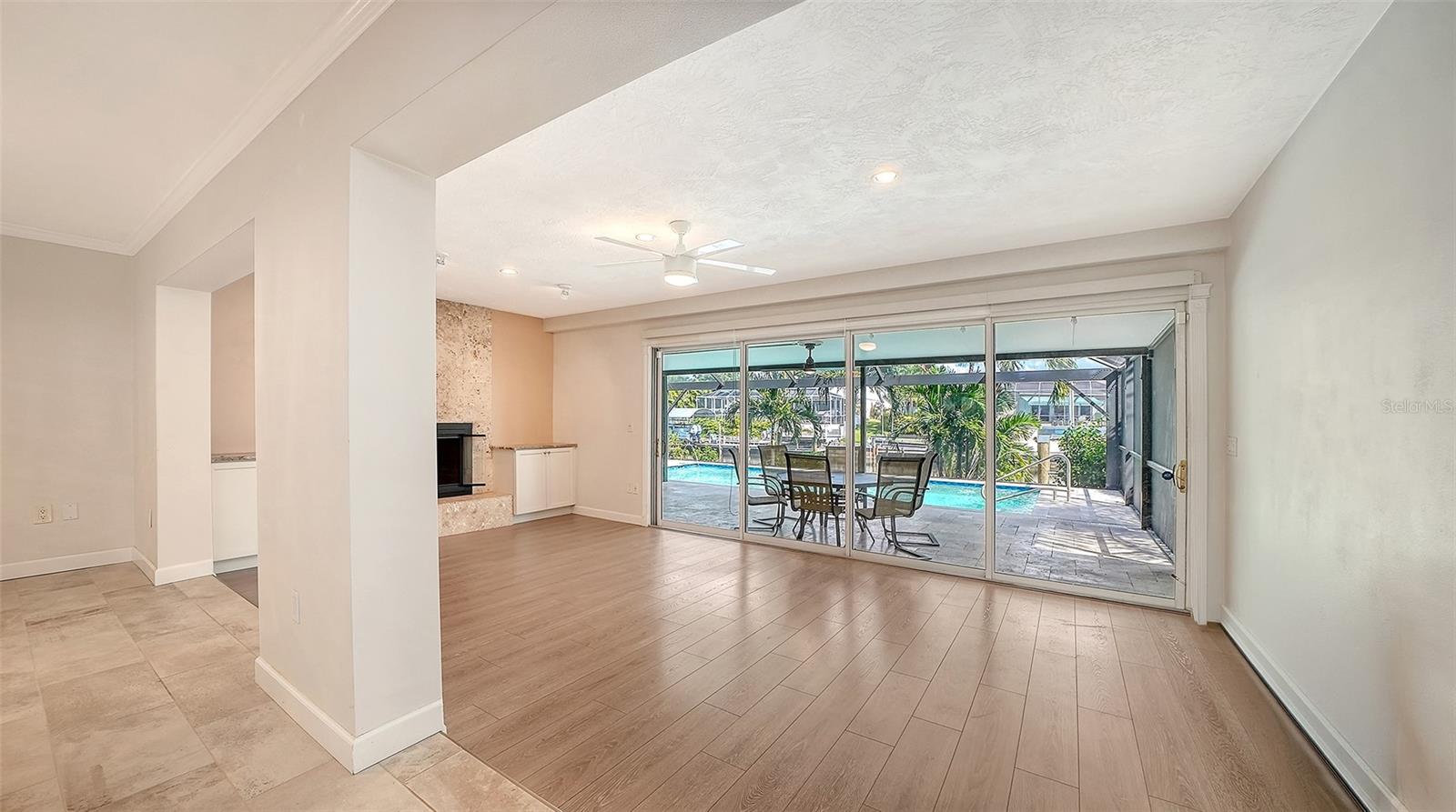 Open the living space to shaded poolside dining.