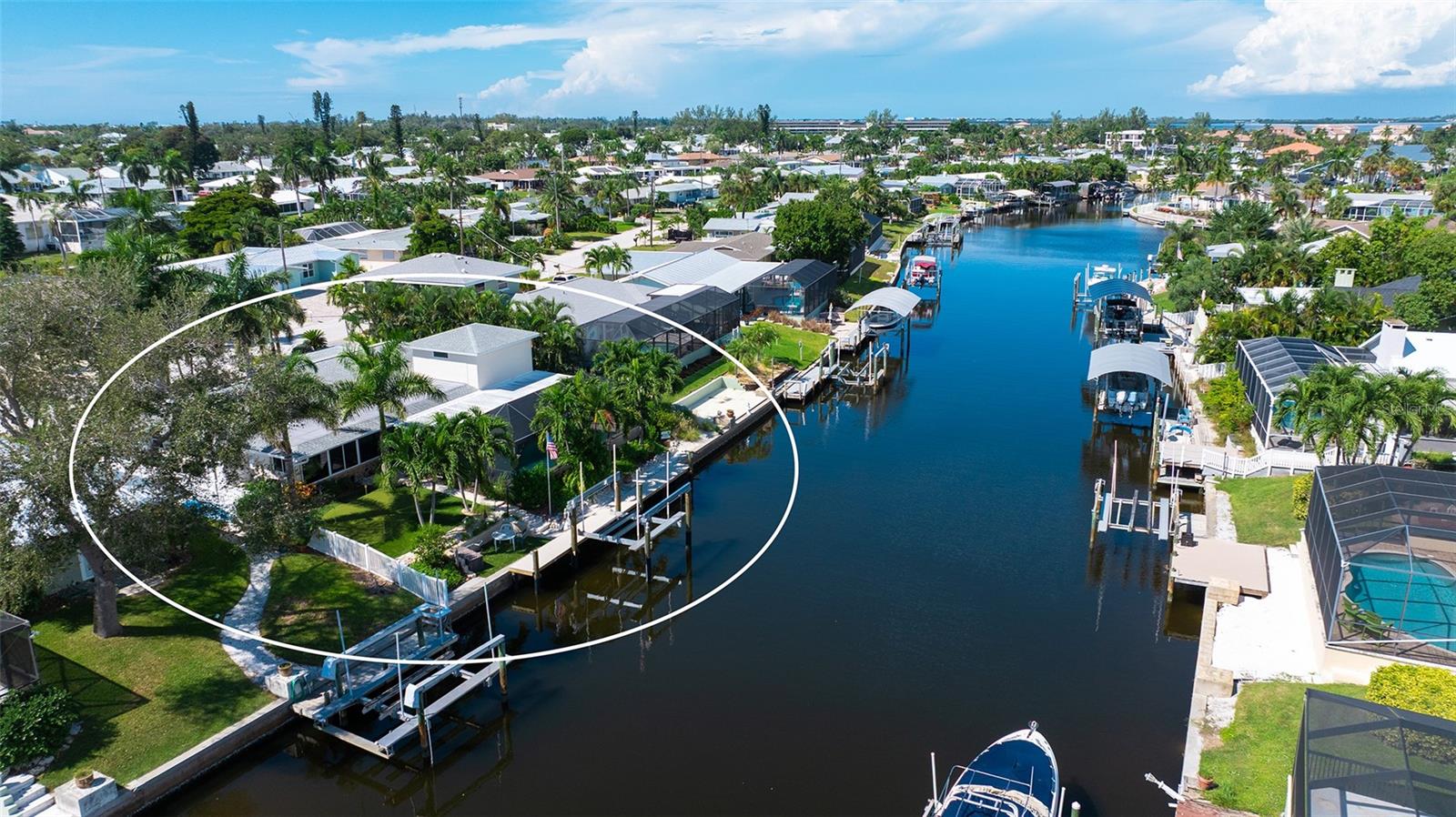 A rear aerial highlights the home and its canal-side setting.