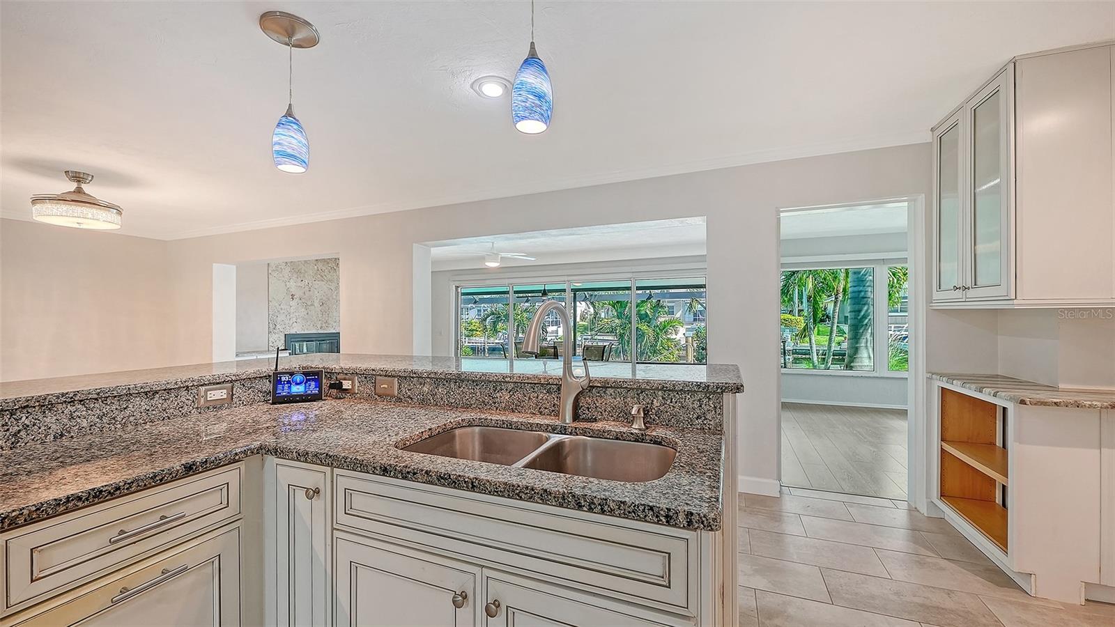 Prepare a meal while staying connected to the living areas.