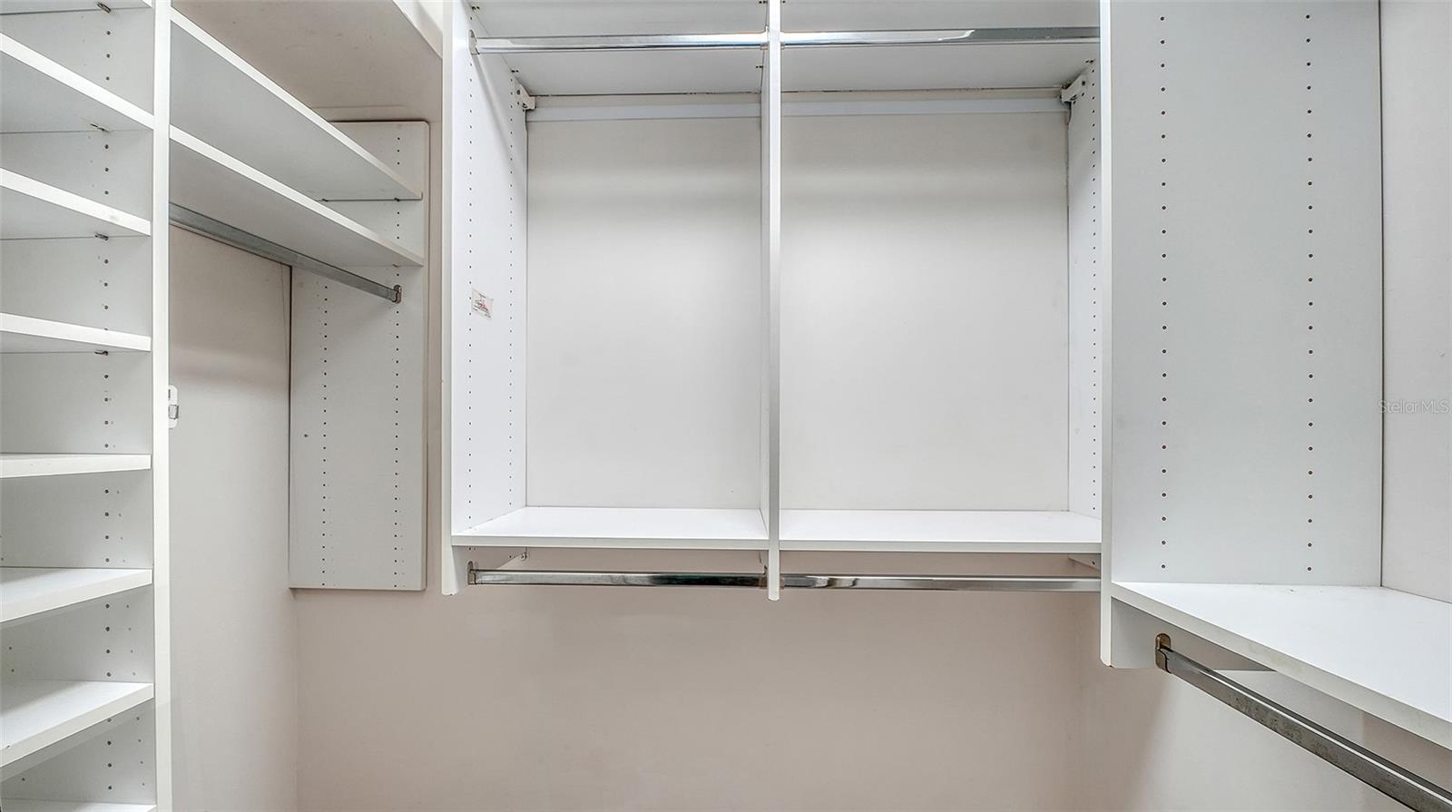 Organized closet shelving keeps your wardrobe within reach.