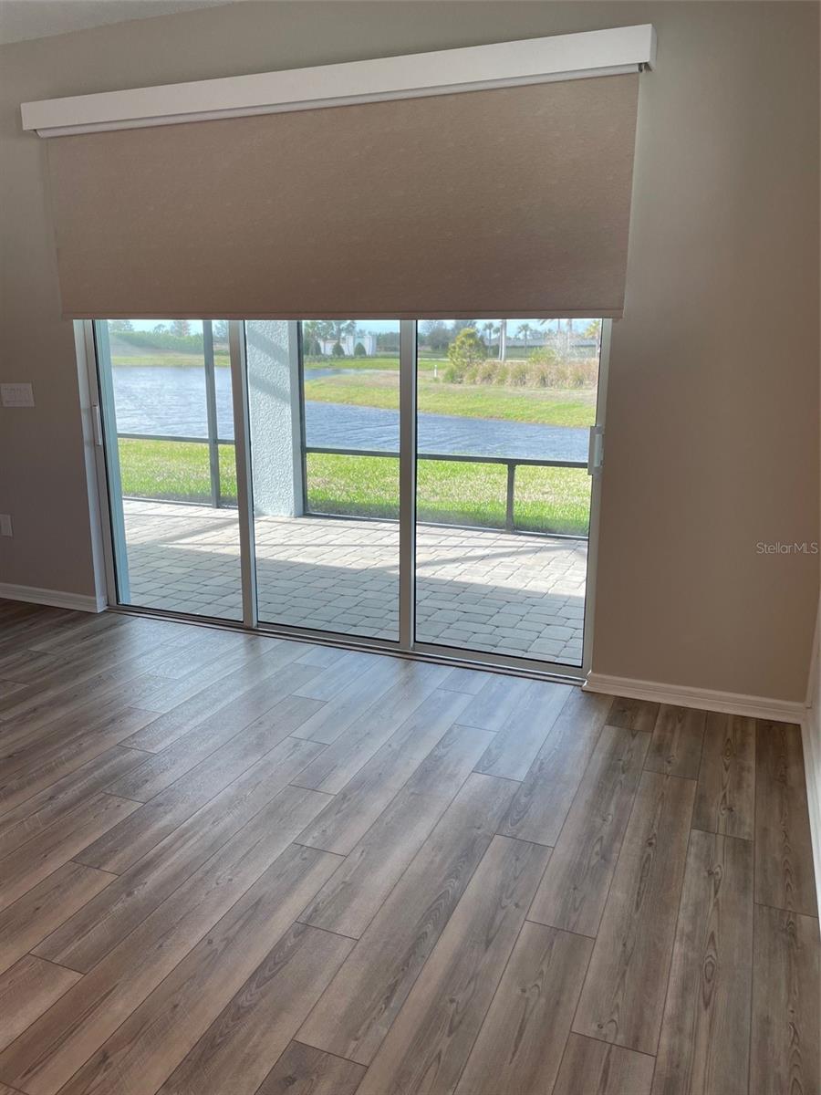 Remote control custom blind at patio door.