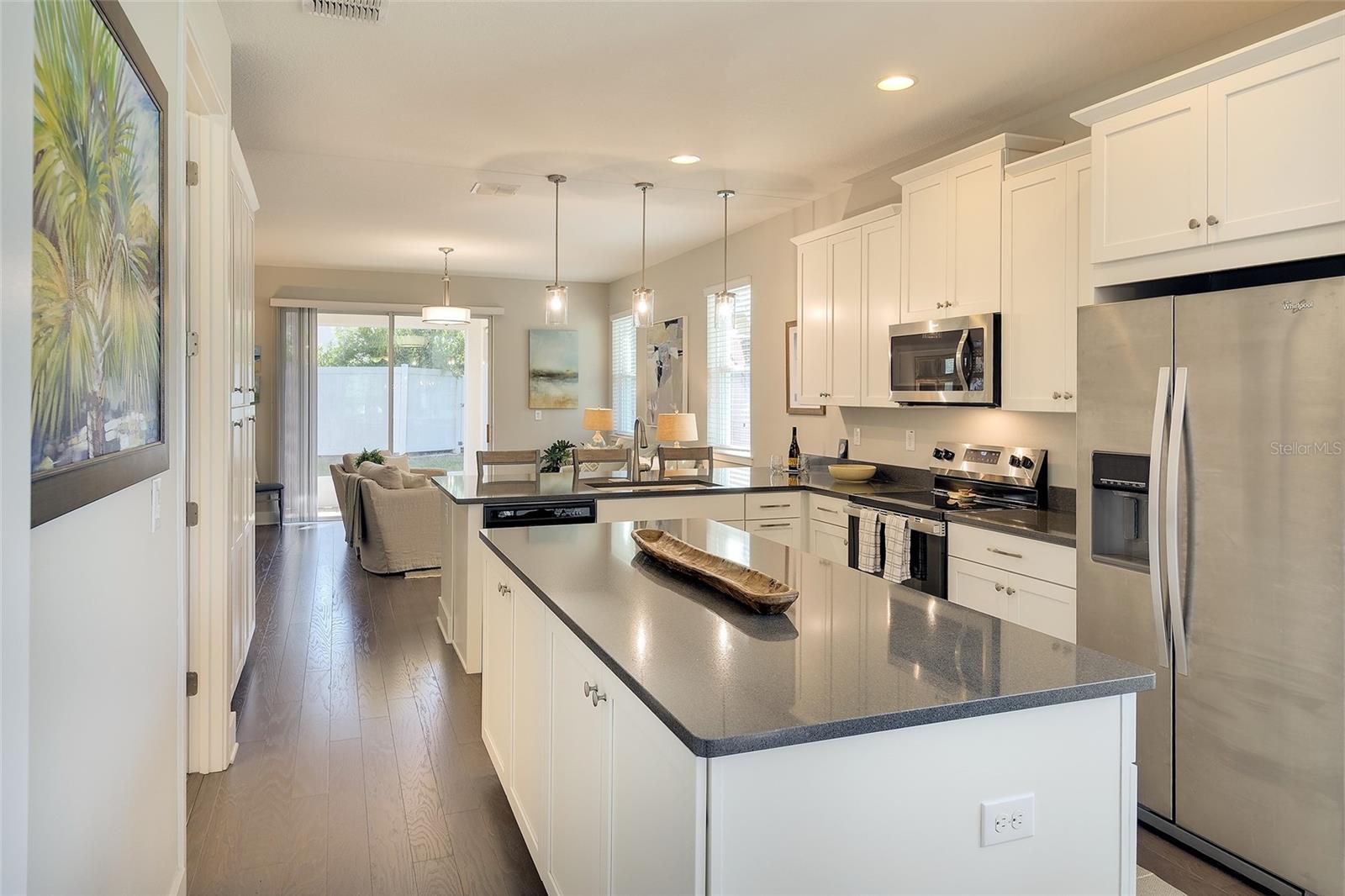 Great storage with 42" uppers, designer cabinetry, dbl pantry and island cabinets!