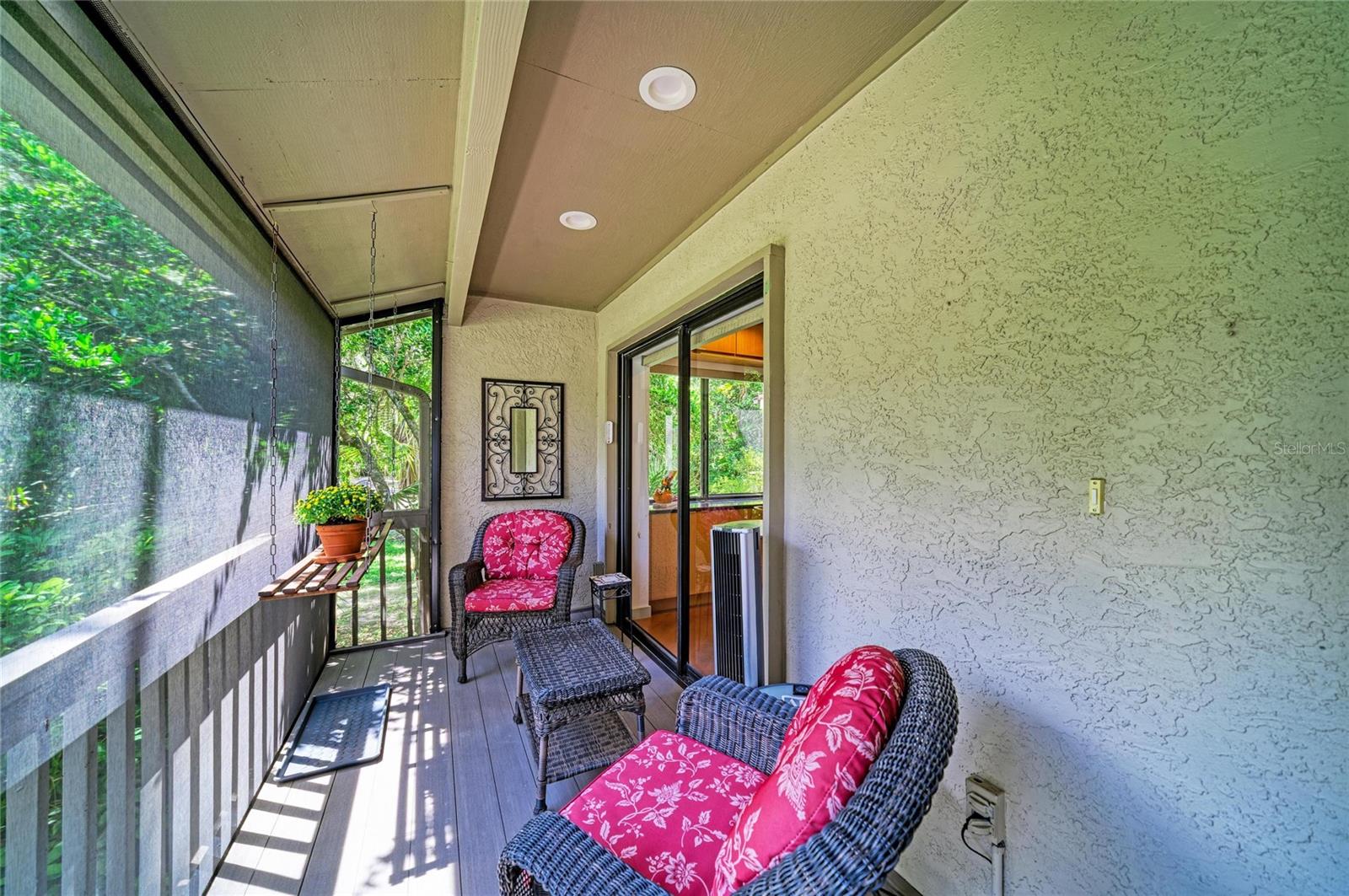Charming screened front porch.  Sliders into the kitchen.