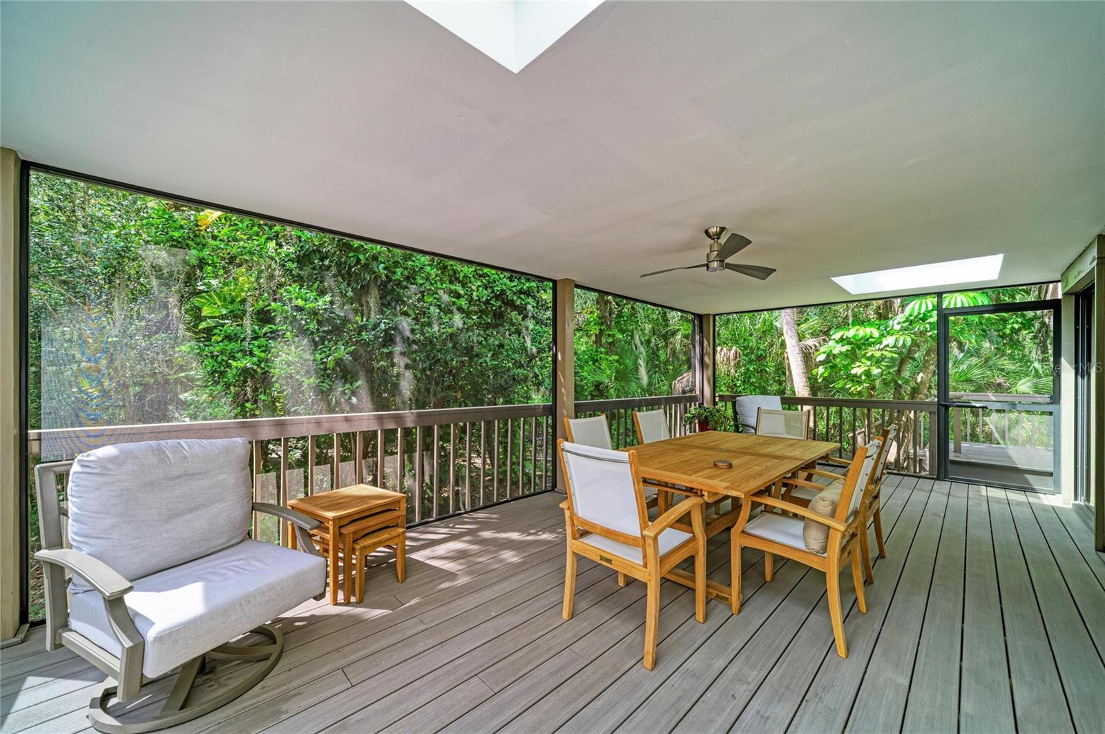 Covered & Screened lanai with skylights.  Door goes to the open air deck.