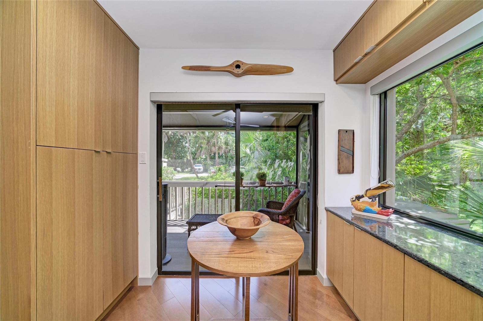 Washer/dryer and pantry in the closets to the left.  And another large window looking out at your tropical oasis.