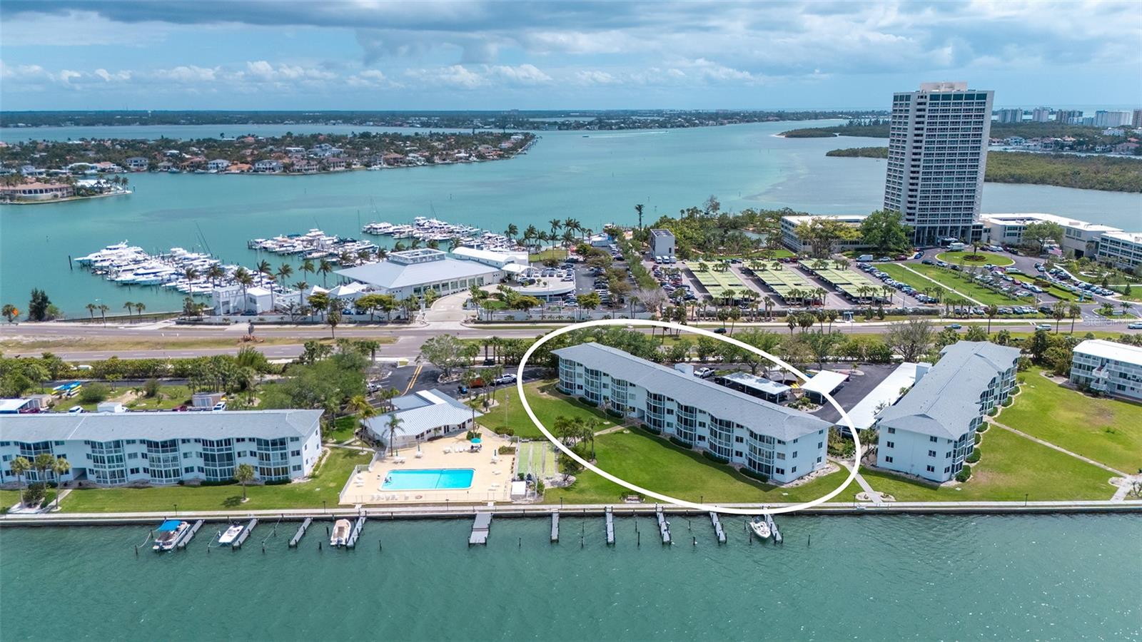 Aerial shot of exterior building. Sarasota Yacht Club directly across the street. Aerial shot of exterior building. Sarasota Yacht Club directly across the street.