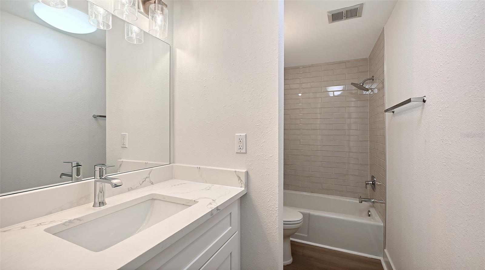 Guest Bathroom with tub/shower combination.