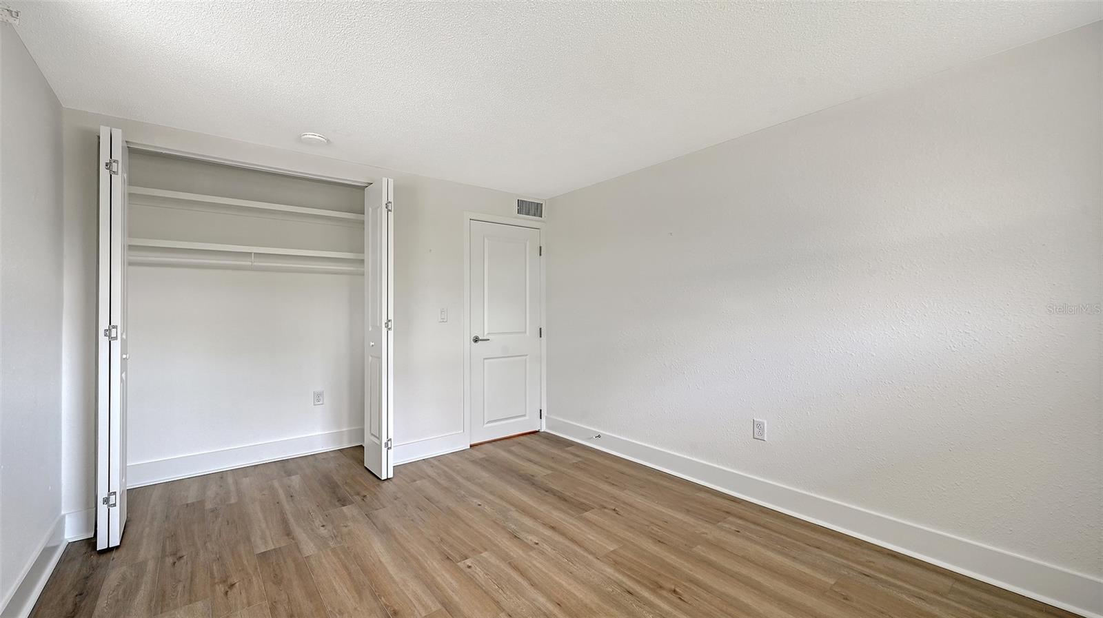 Guest bedroom (bedroom two) with built-in closet.