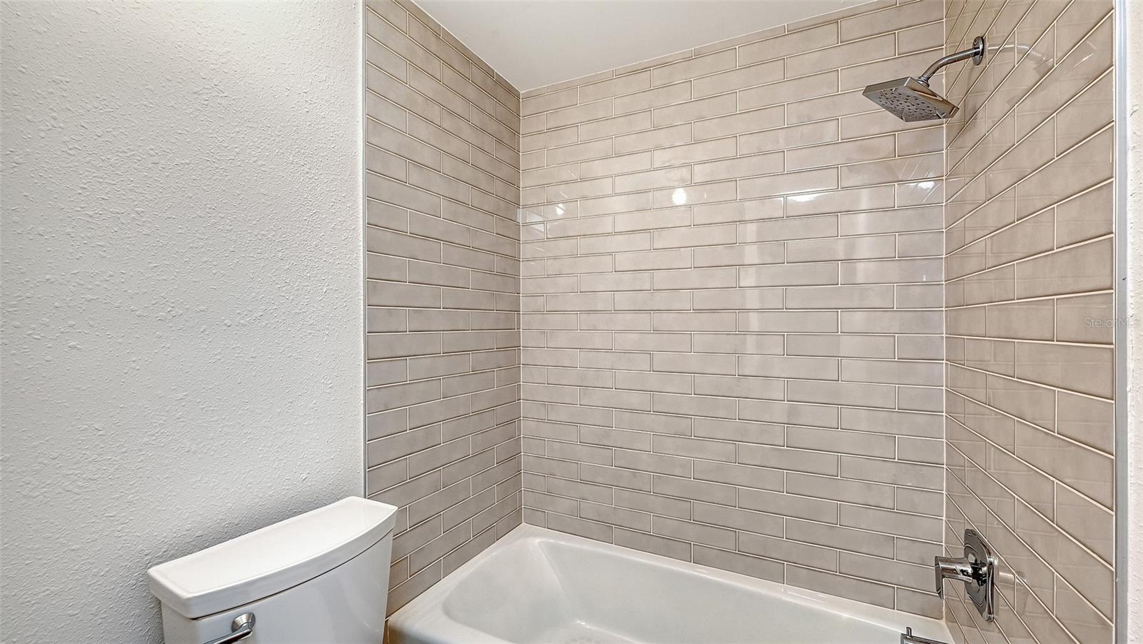 Guest Bathroom with tub/shower combination.