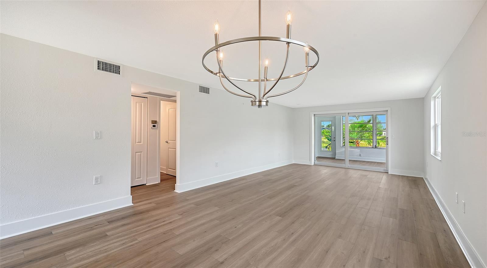 Dining Room/Living Room combination. Hallway to bedrooms.