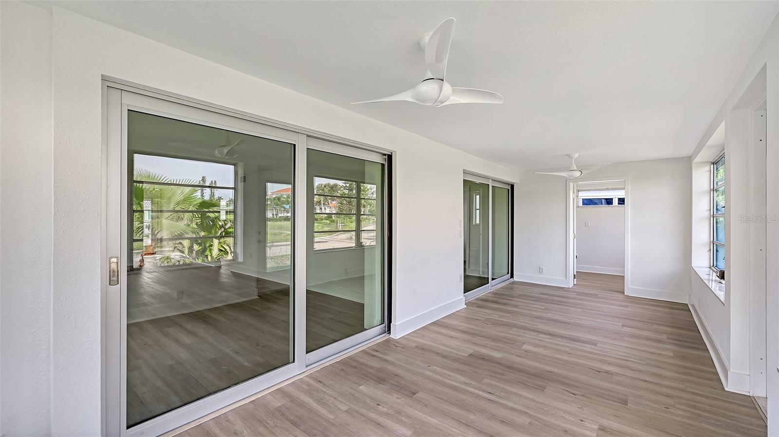 Lanai off Living Area and Primary Bedroom.