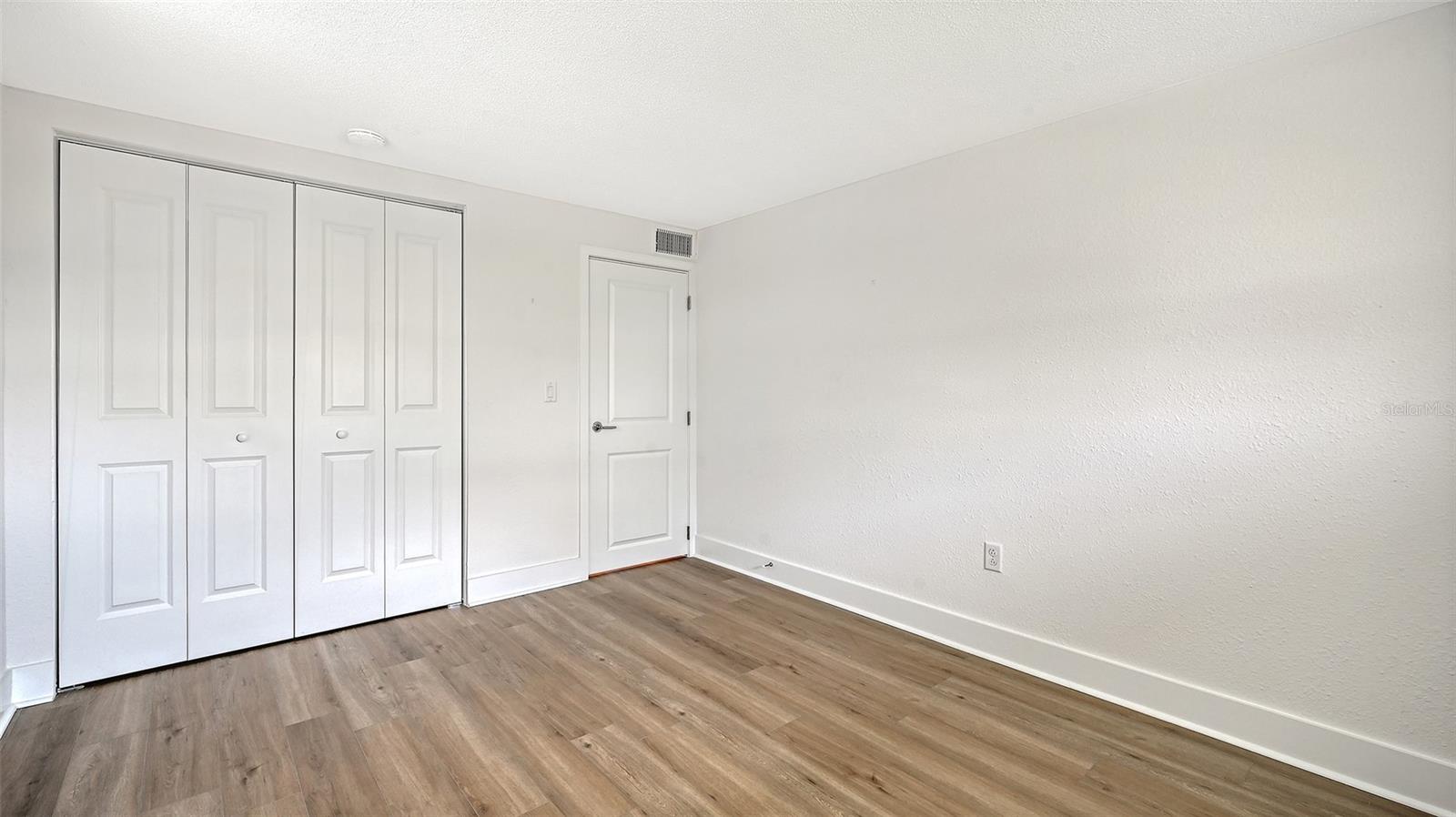 Guest bedroom (bedroom two) with built-in closet.