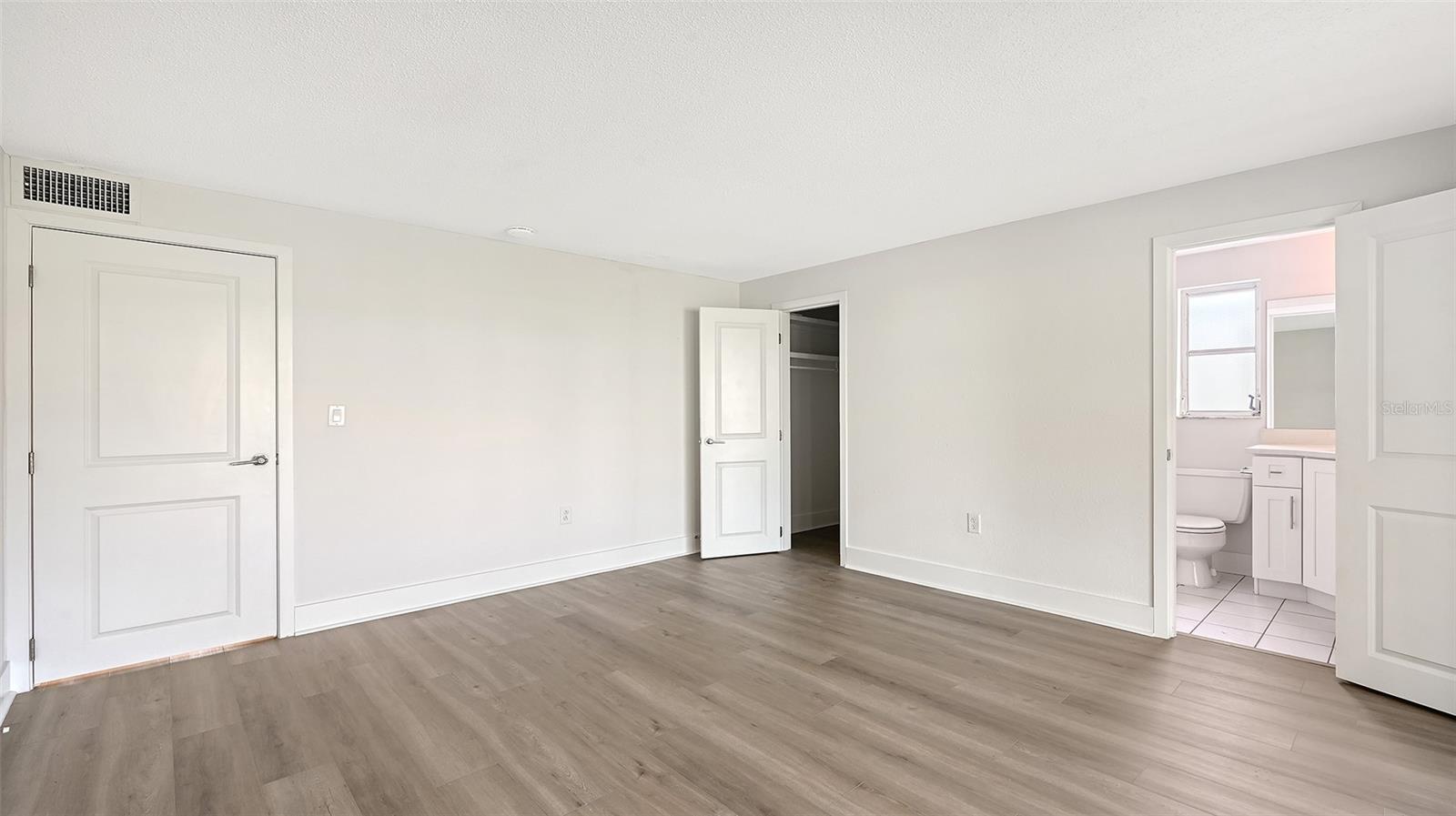 Primary Bedroom (bedroom one) with ensuite bathroom and walk-in closet.