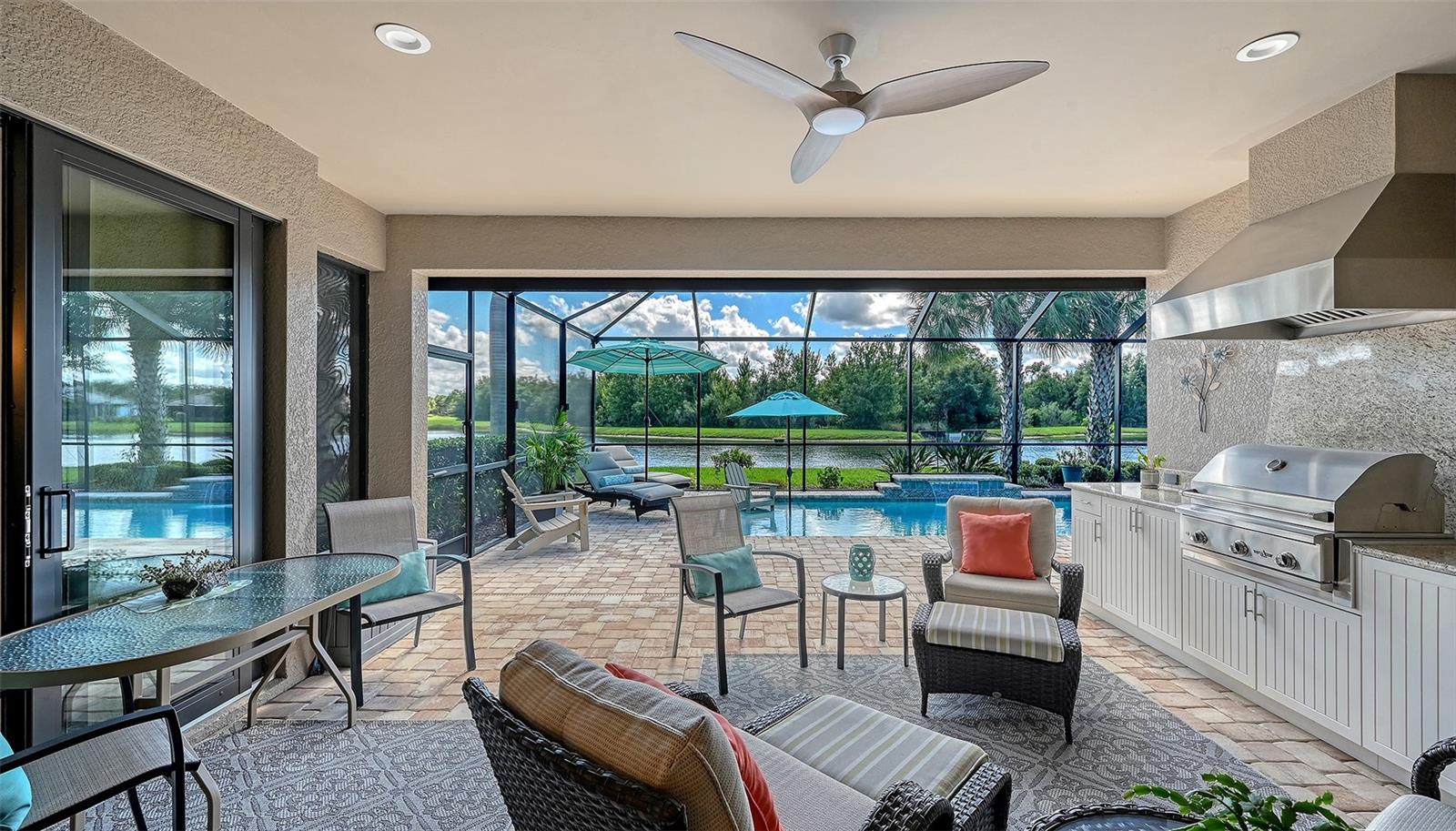 Where luxury living meets outdoor living with an appointed outdoor kithchen, propane grill and a beverage refrigerator for your convenience.