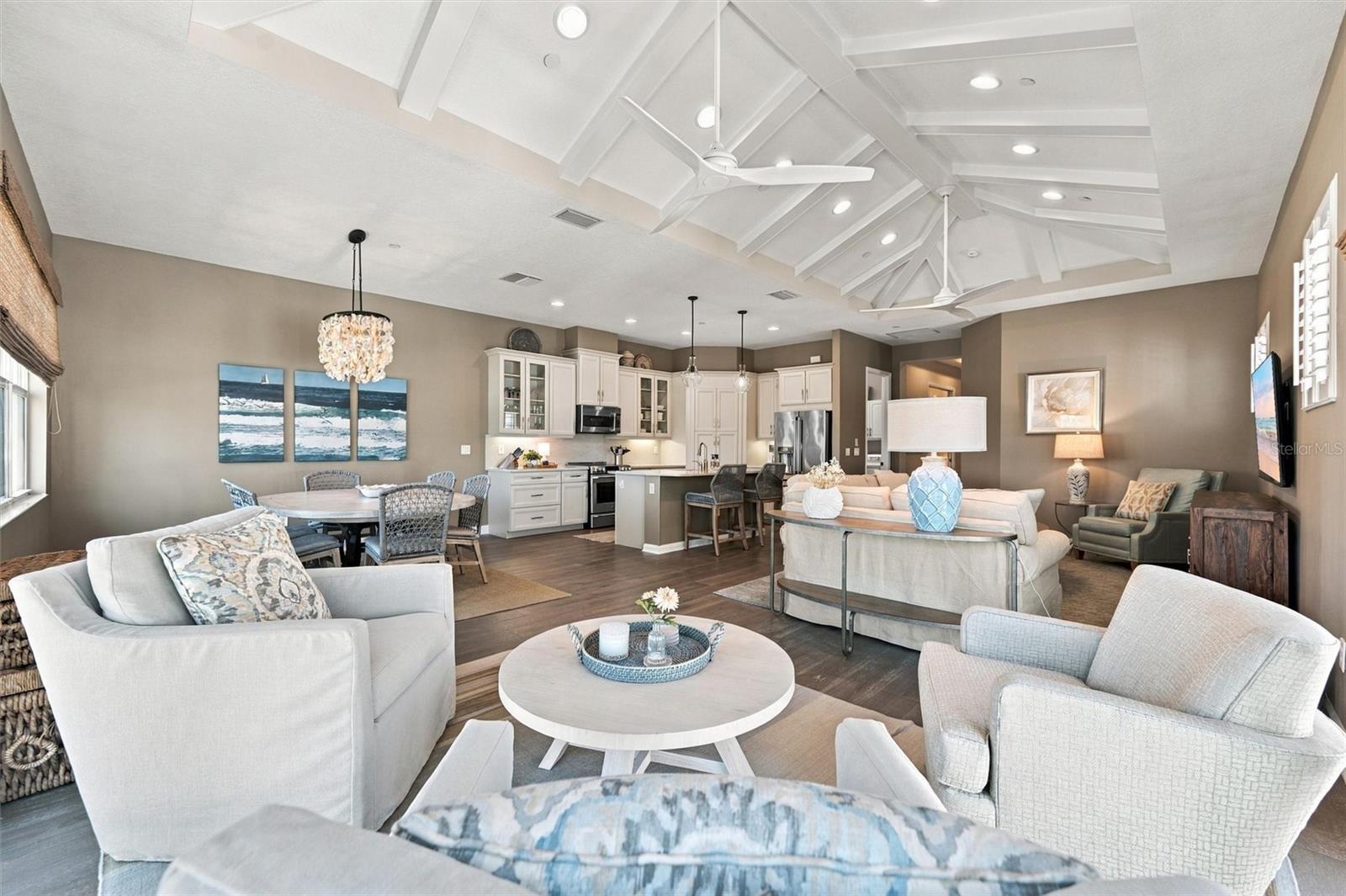 Enjoy peaceful Sapphire Lake views from this beautifully appointed home, featuring an open-concept floor plan, soaring vaulted ceilings, and Mohawk engineered hardwood flooring.