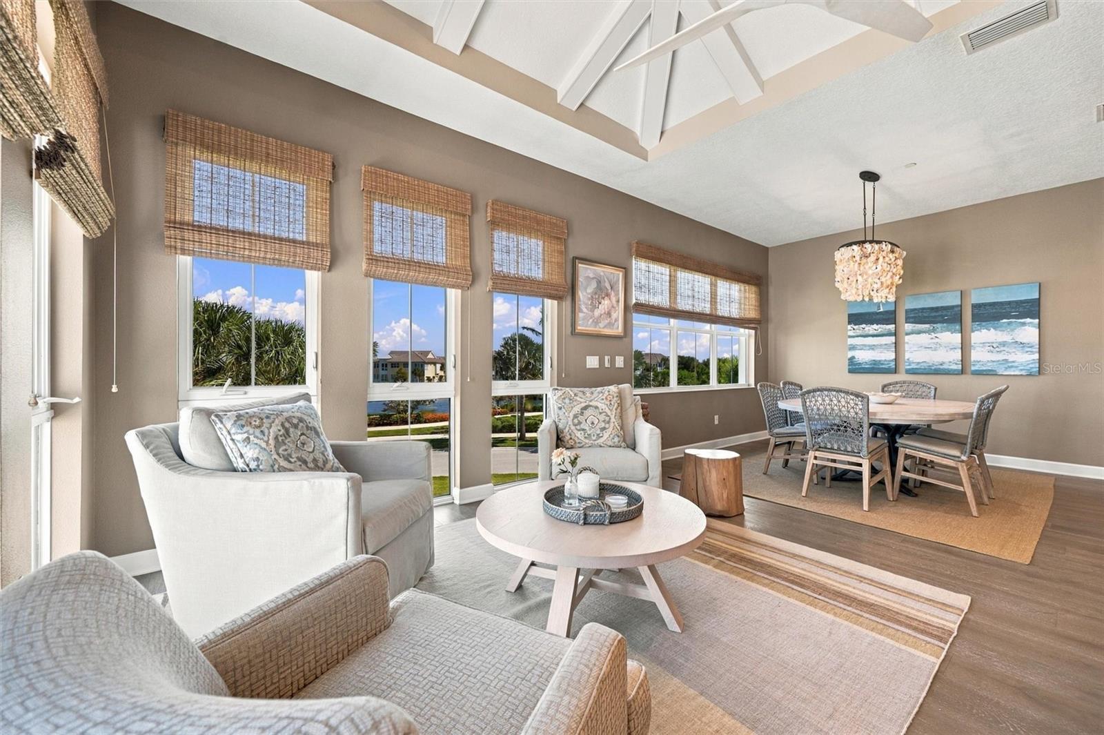 Enjoy peaceful Sapphire Lake views from this beautifully appointed home, featuring an open-concept floor plan, soaring vaulted ceilings, and Mohawk engineered hardwood flooring.
