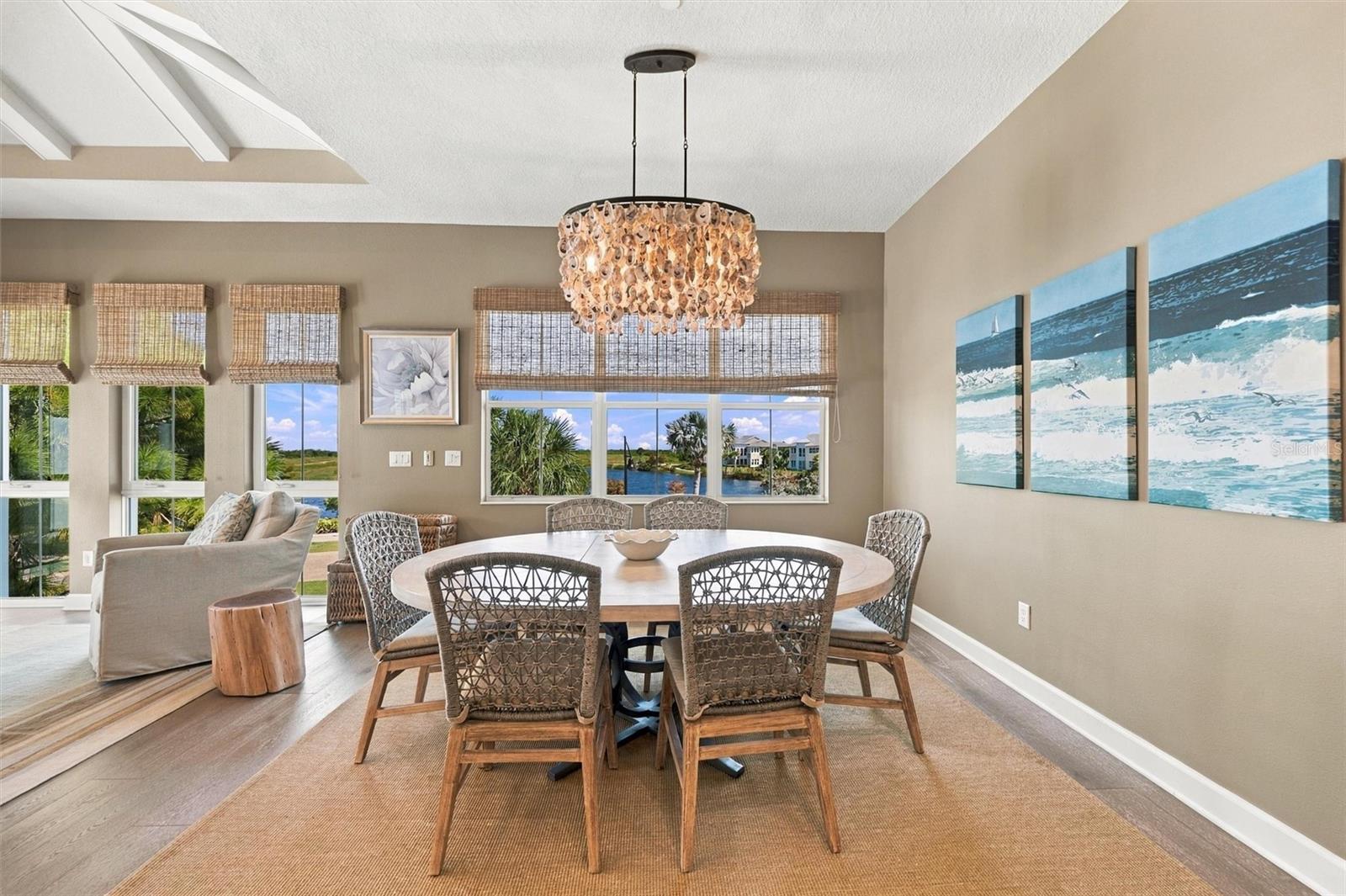 Enjoy peaceful Sapphire Lake views from this beautifully appointed home, featuring an open-concept floor plan, soaring vaulted ceilings, and Mohawk engineered hardwood flooring.