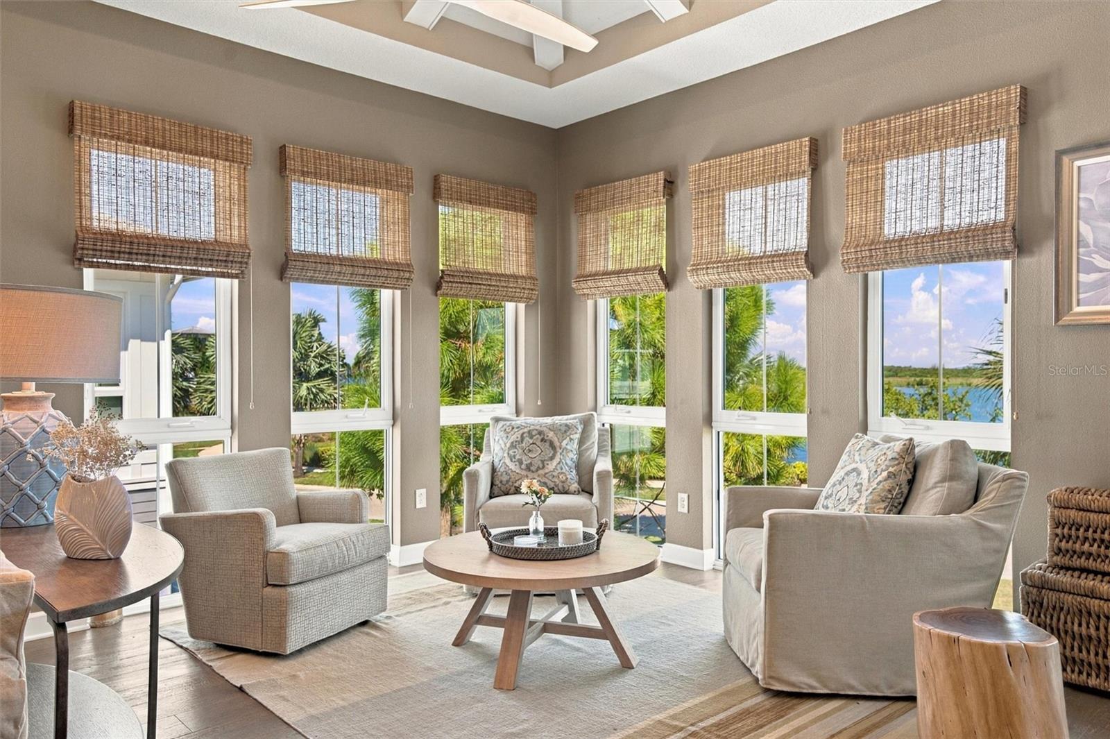 Enjoy peaceful Sapphire Lake views from this beautifully appointed home, featuring an open-concept floor plan, soaring vaulted ceilings, and Mohawk engineered hardwood flooring.