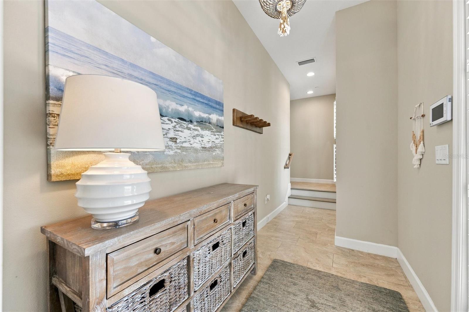Welcome through the front entry, with convenient access to the second level by either stairs or elevator.