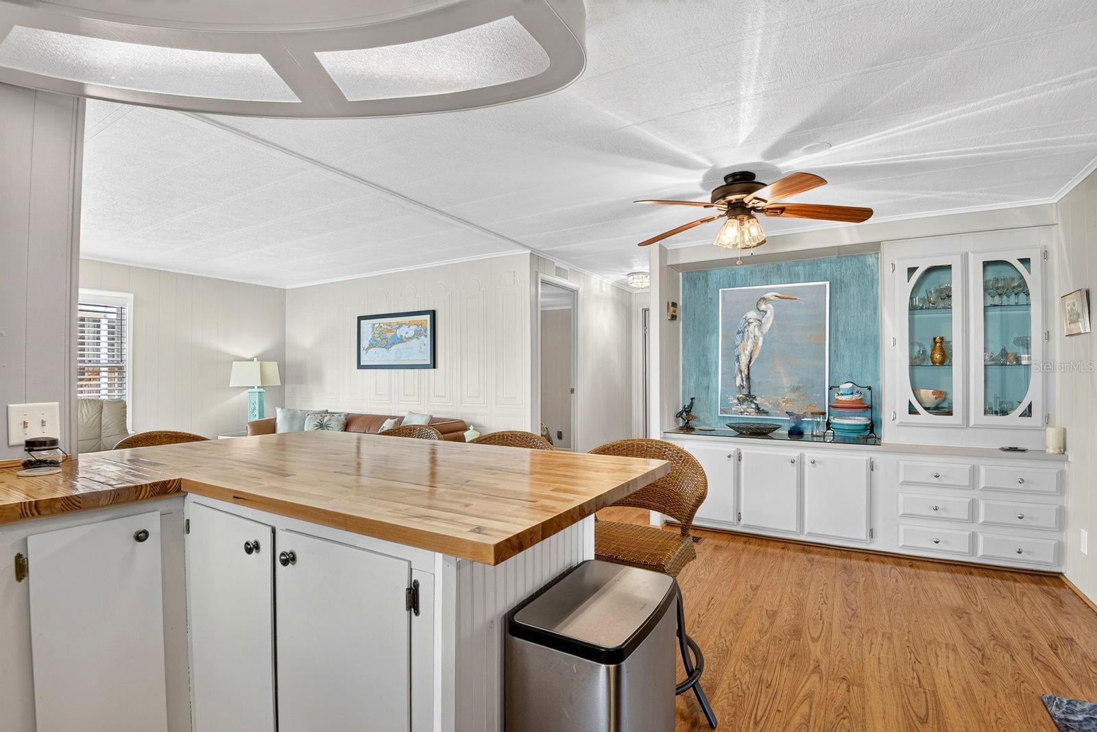 Kitchen facing dining area with built in cabinet