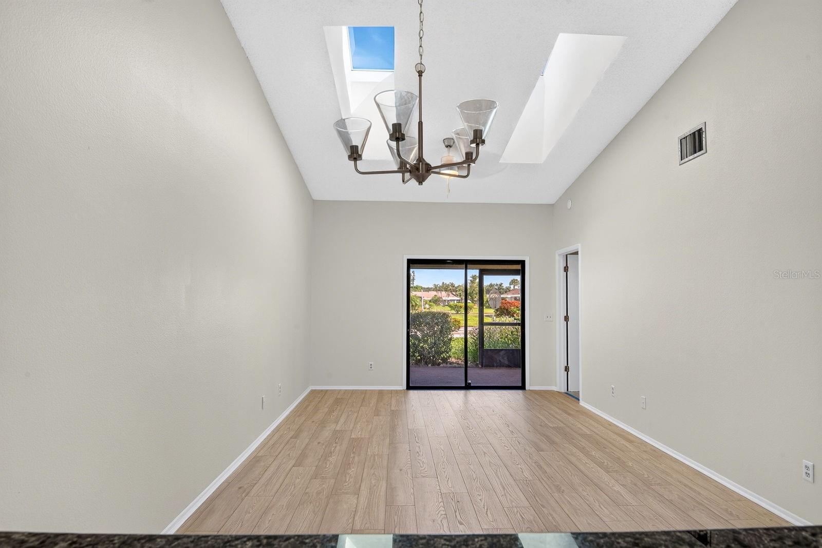 Living and Dining area wide open with skylights