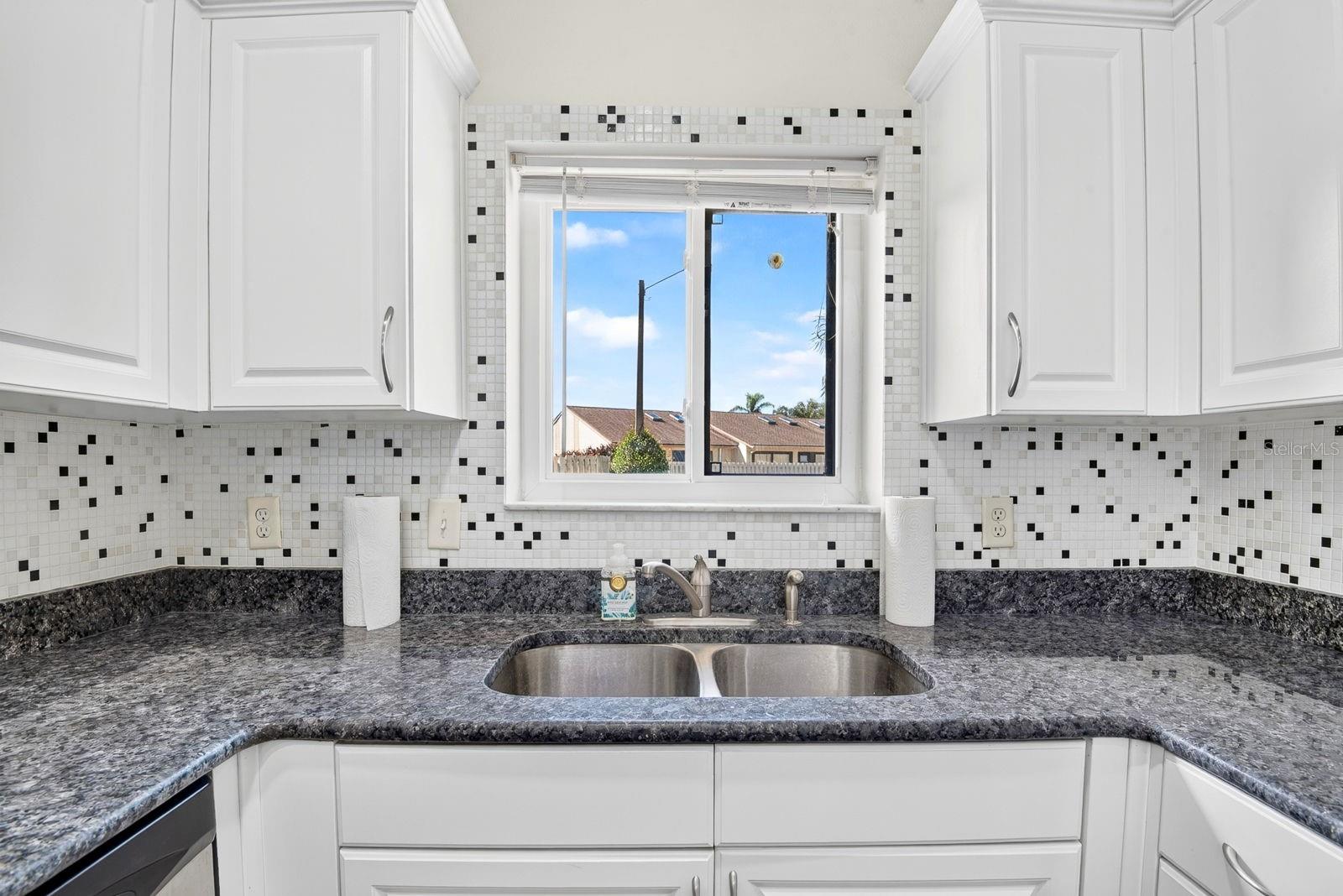Kitchen overlooking a nice window outdoor view