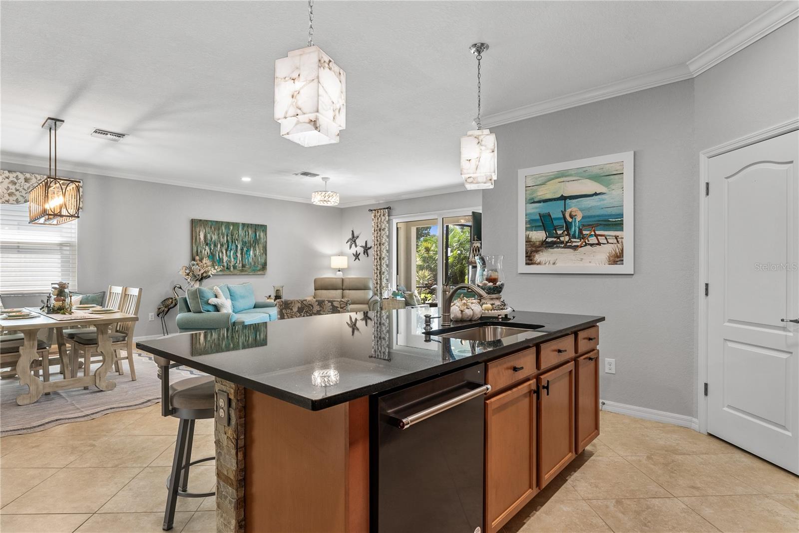 Facing dining and living area from inside kitchen area