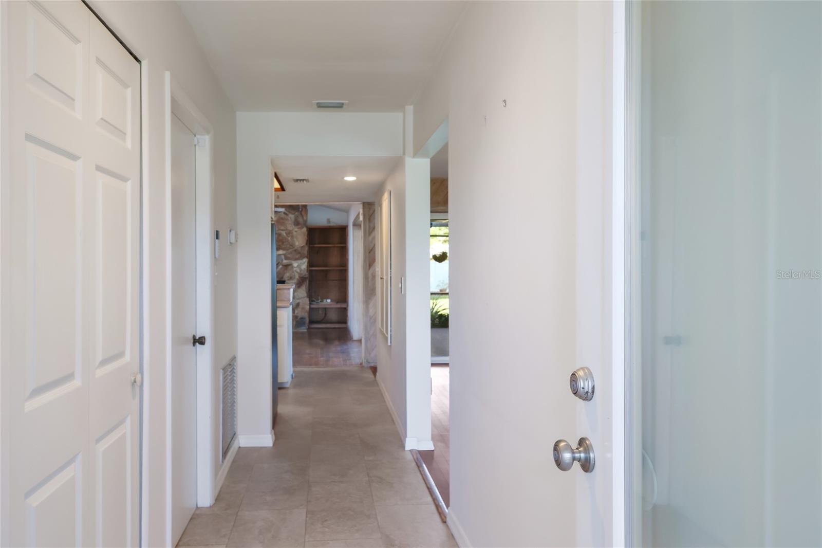 Welcome in!  Foyer and hallway entrance into the home