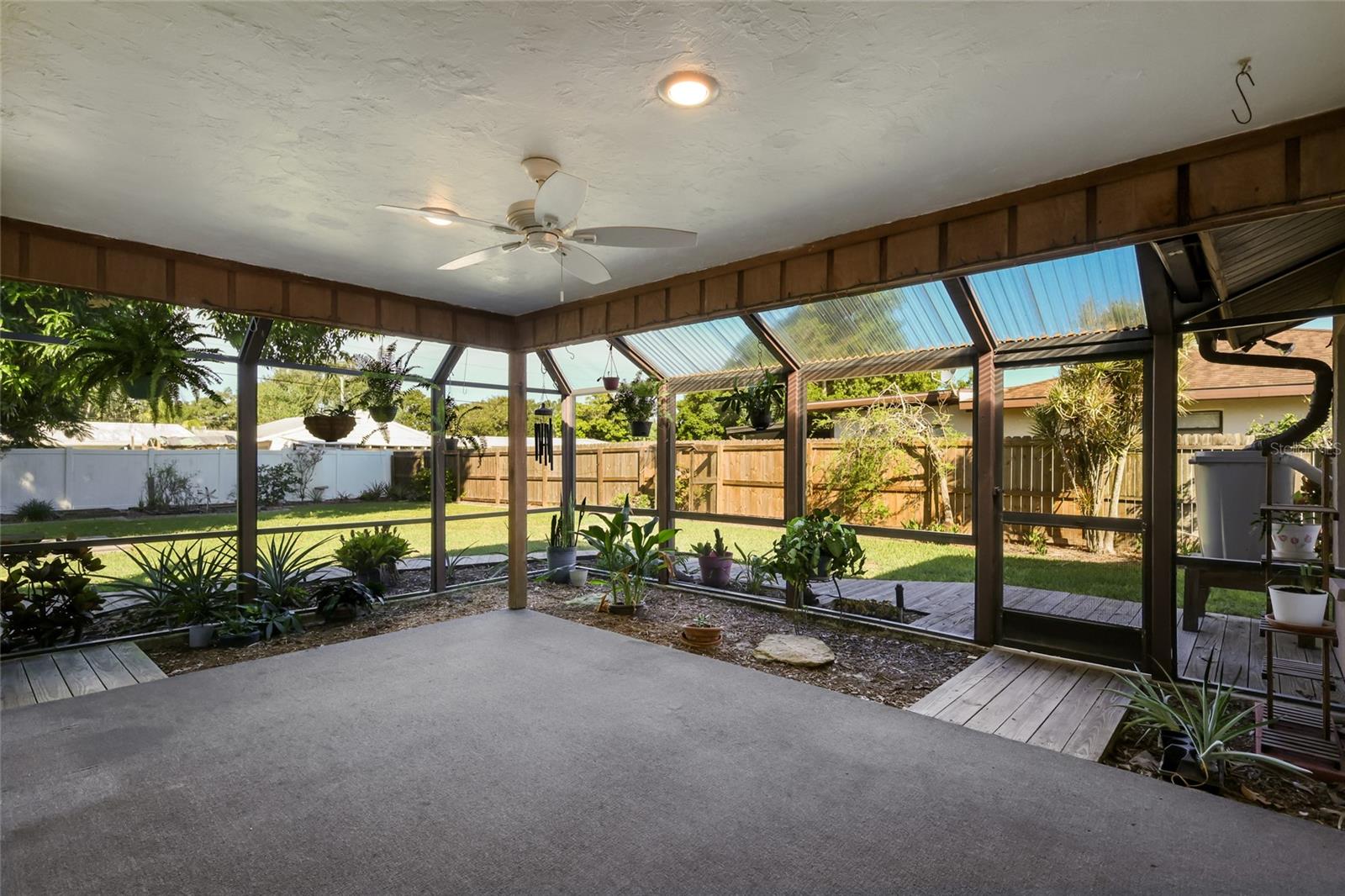 Covered, screened in lanai with fan and lighting