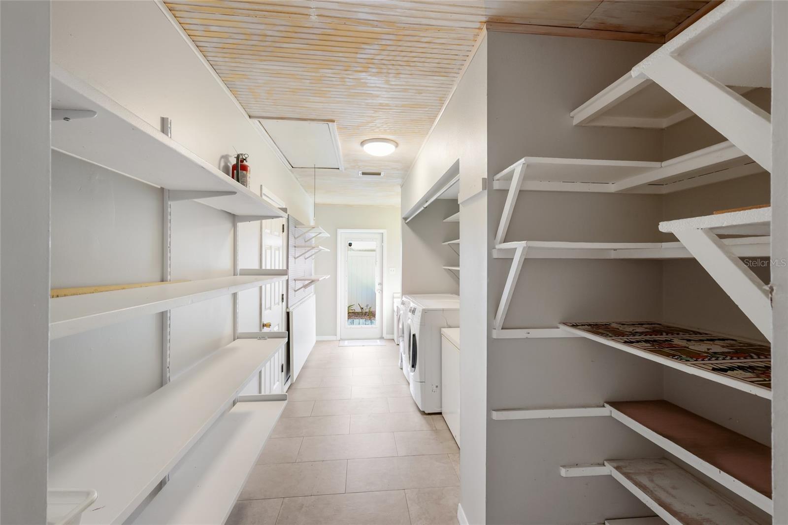 Interior Laundry room w/ built in shelving