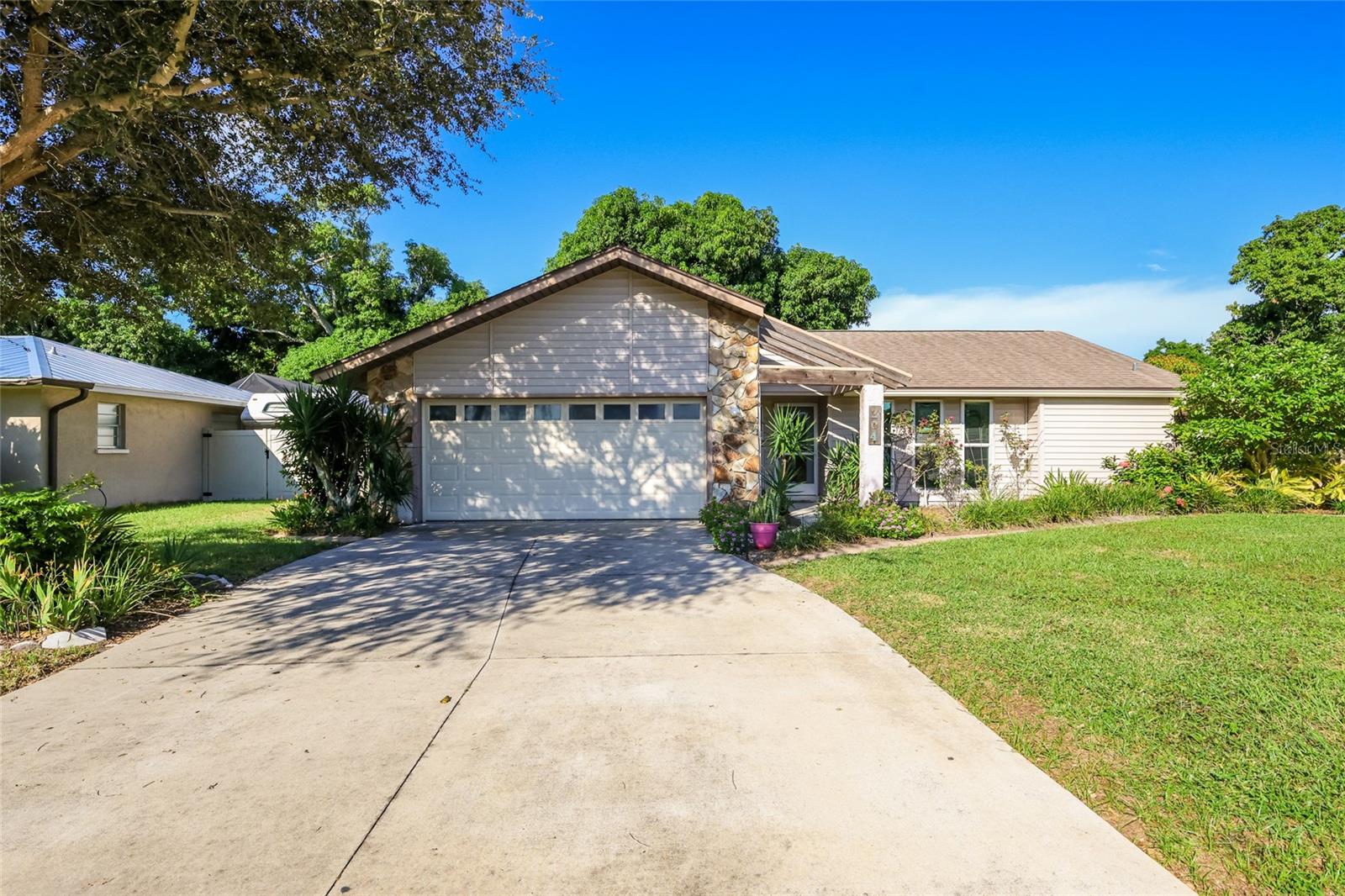 2 car garage w/ impact door and plenty of parking