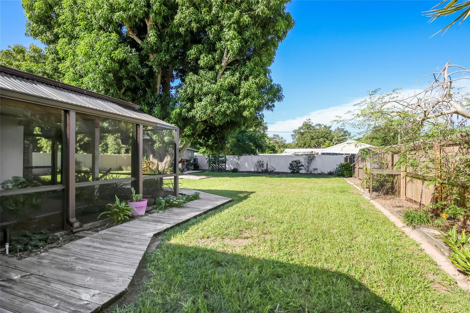 This backyard is meticulously maintained and features a fantastic outdoor living space.