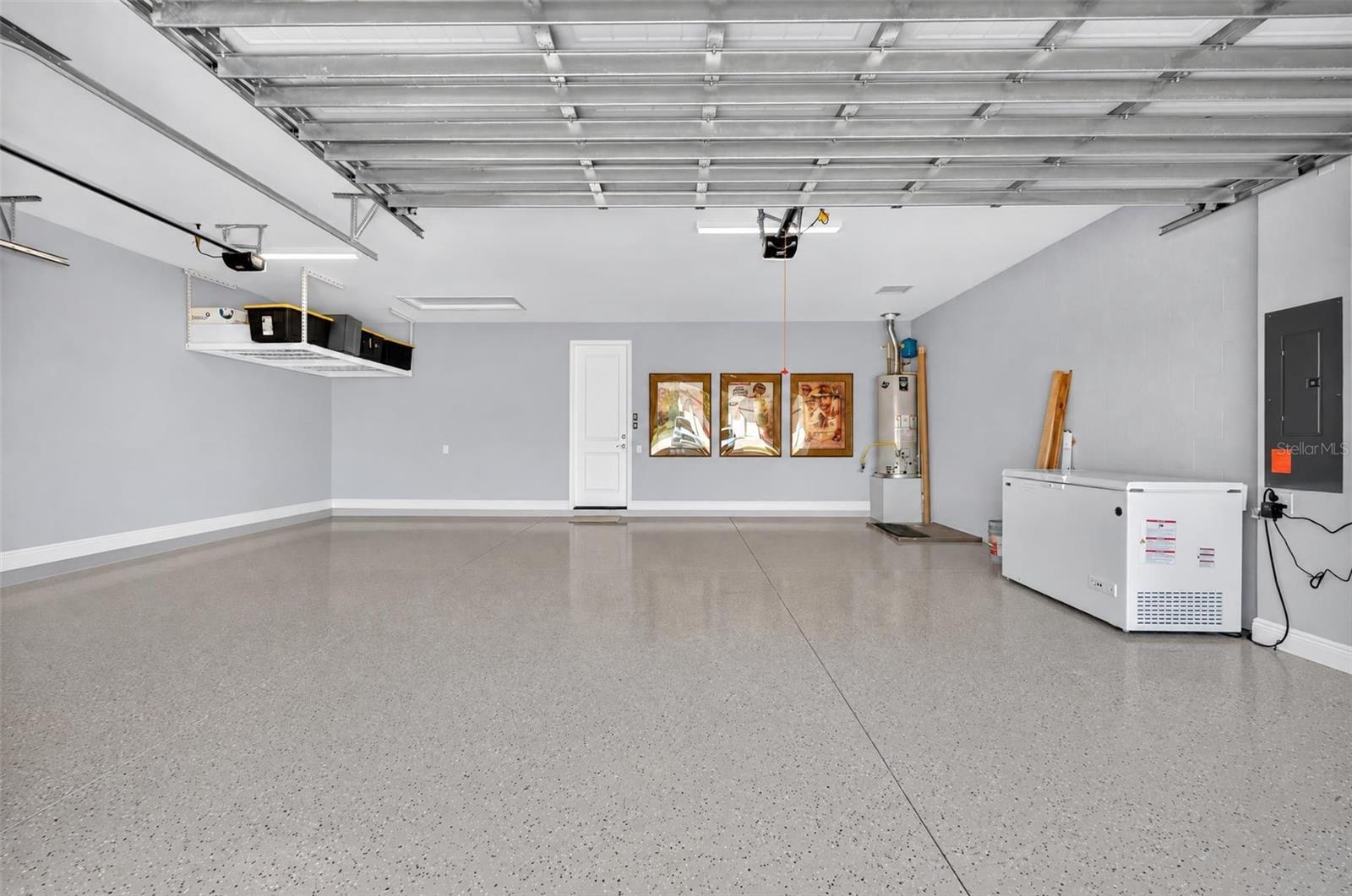 3 car garage with epoxy and overhead storage