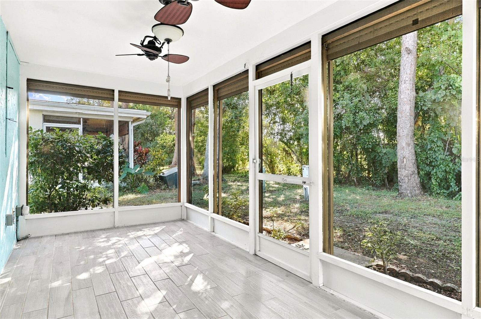 Lanai with motorized roll-down shutters