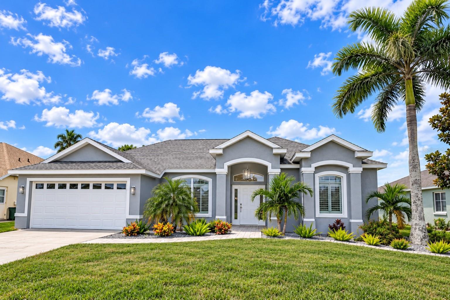 Front Exterior  AI-enhanced photo for lighting, color, and overall image clarity. No structural or property features altered.