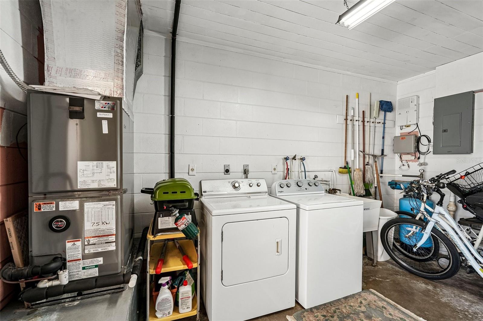 Shared laundry / utility room plus storage.