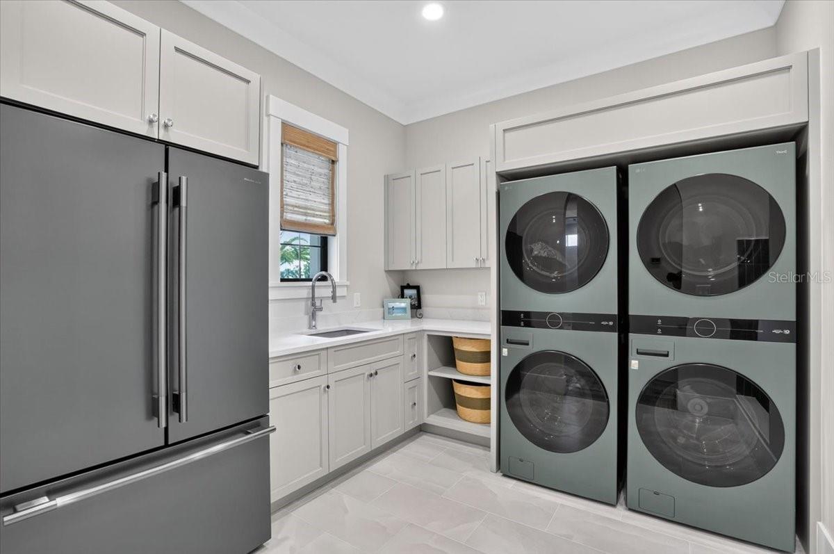 Dual double stack Washer and Dryer.  Color matched refrigerator.