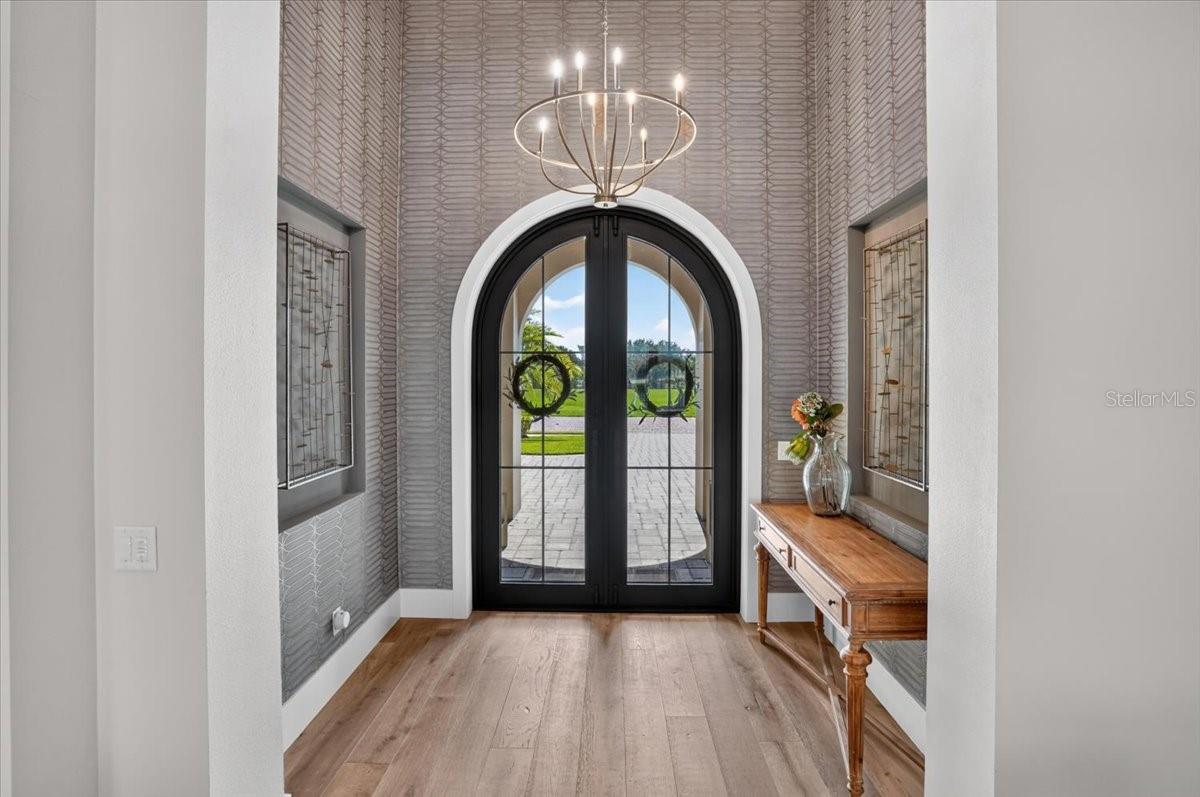 Custom made in Italy, 10' Impact Glass and Iron doors.