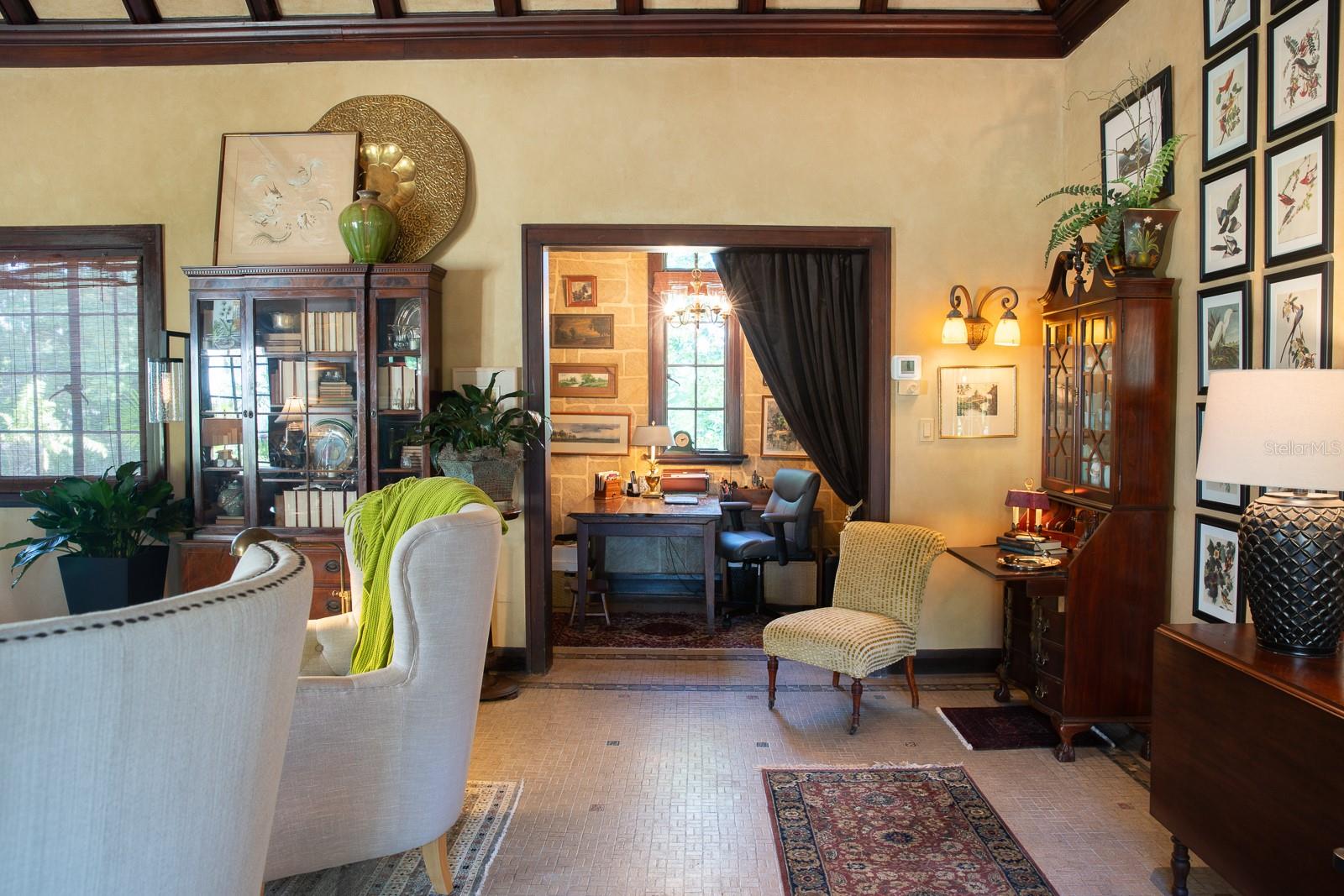 Office space open to living room (salon).