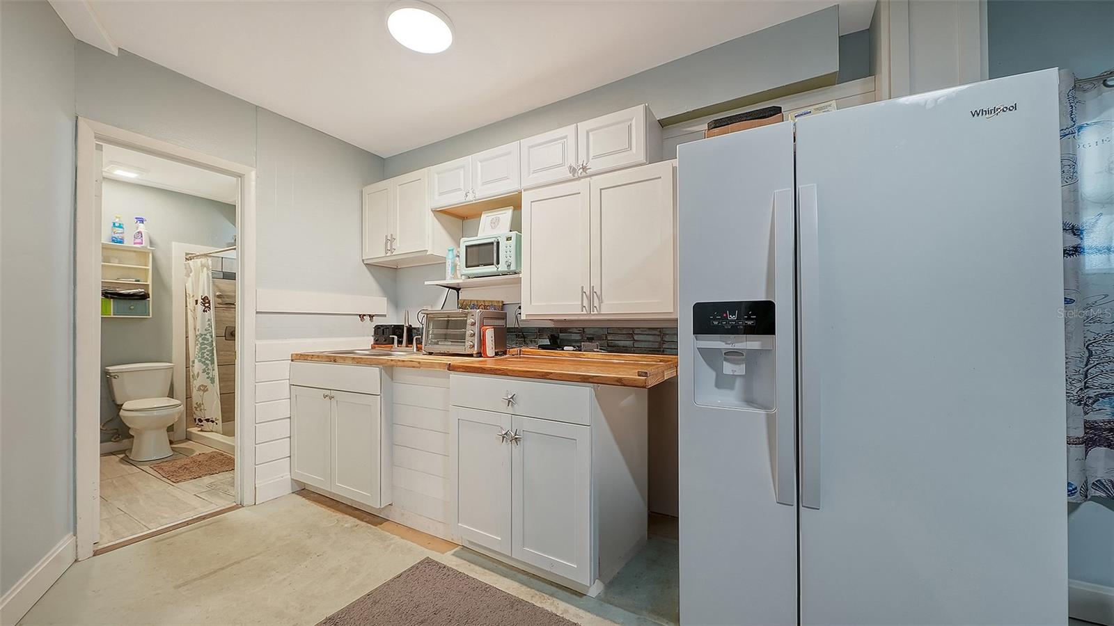 Ground floor under Unit A, efficiency apartment or in-law suite.
