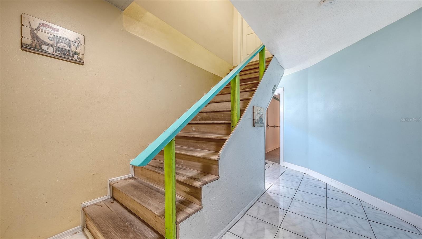 Unit B, entry hallway and stairs to Unit B.