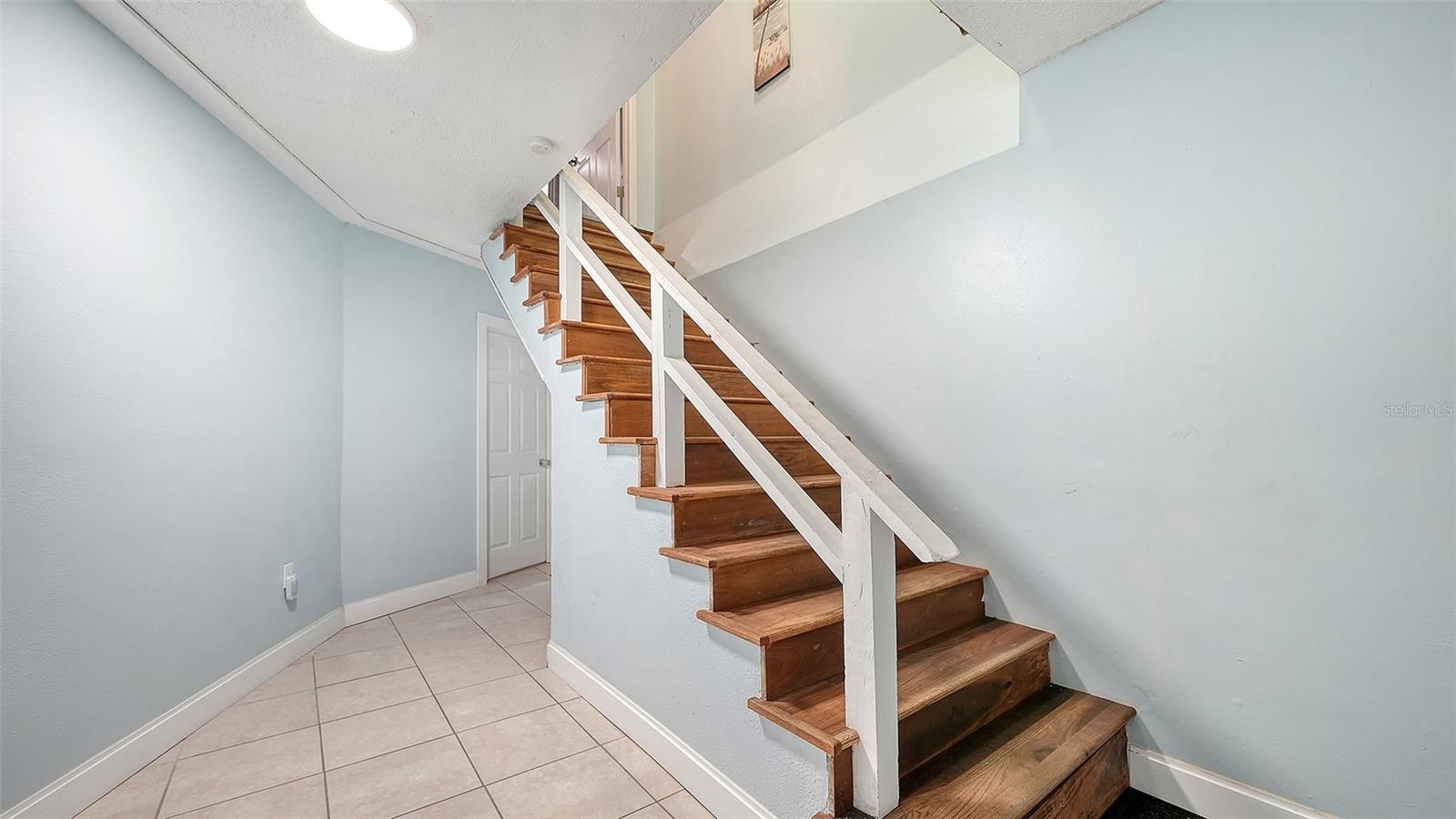 Unit A, entry hallway and stairs to Unit A.